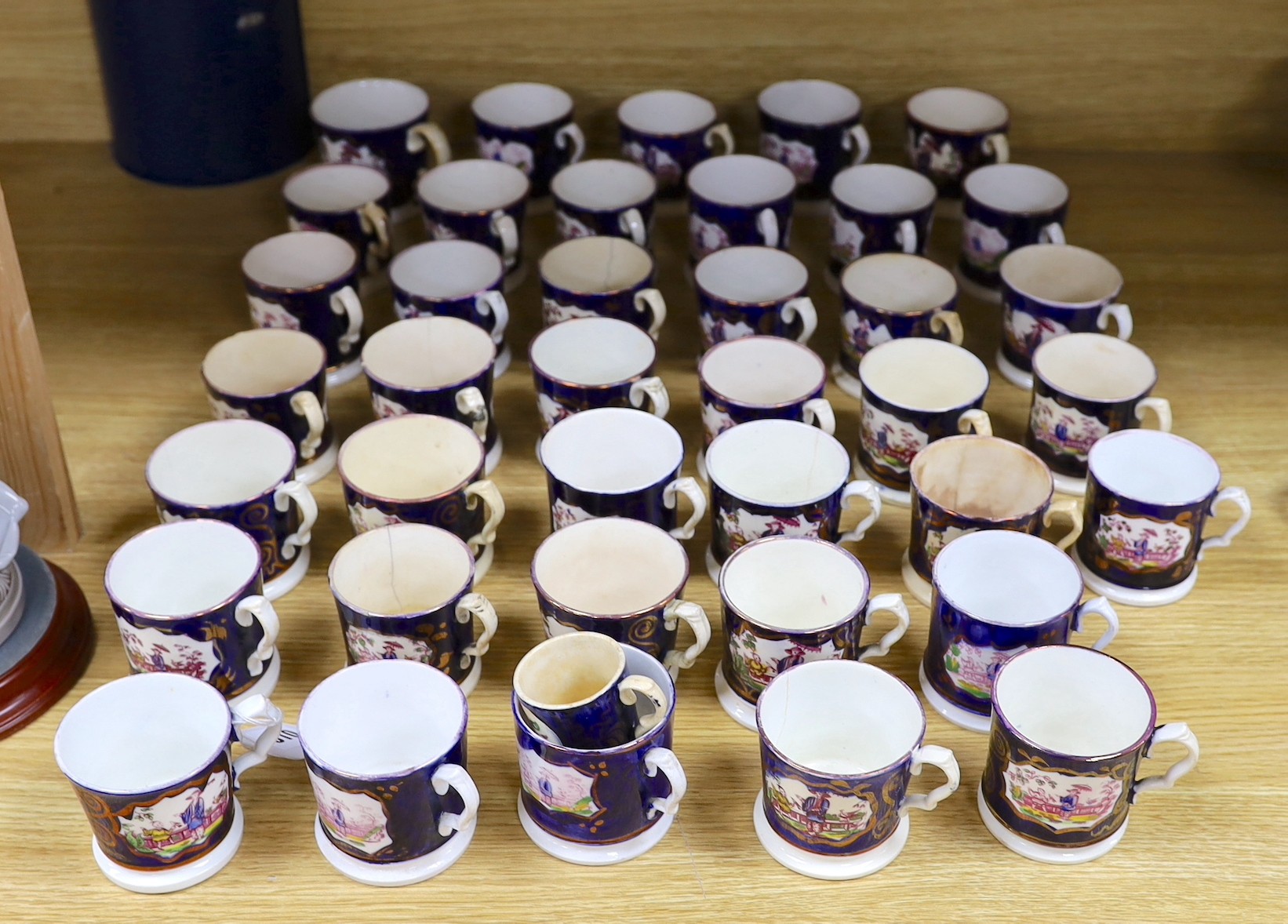 A quantity of Gaudy Welsh lustre cups with chinoiserie motifs, approx 40, varying in size                                                                                                                                   