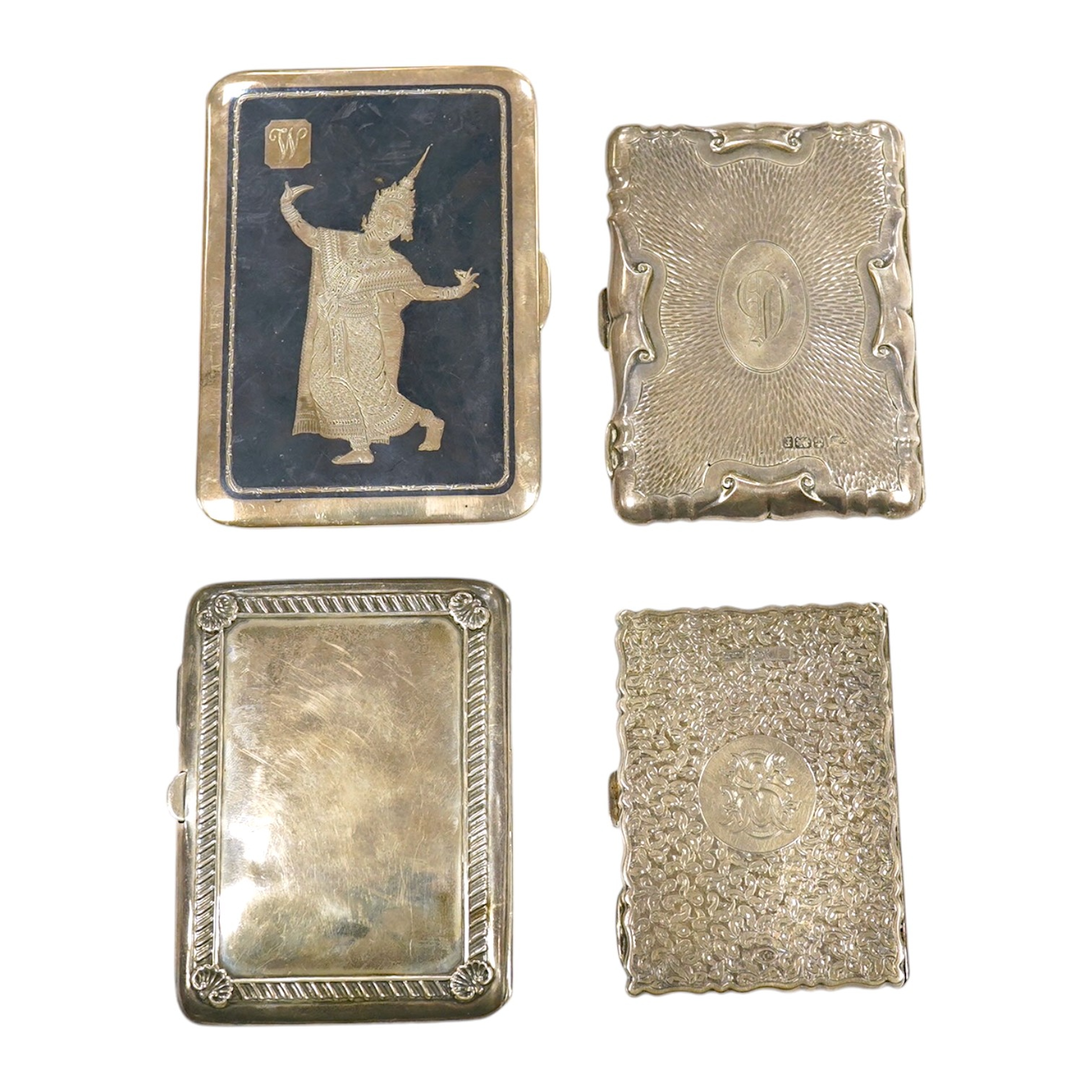 Three Edwardian and later silver note cases, gross 9.5 oz, and a sterling cigarette case with Queens Royal Regiment inscription and niello decoration, 5.5 oz. Good condition.                                              