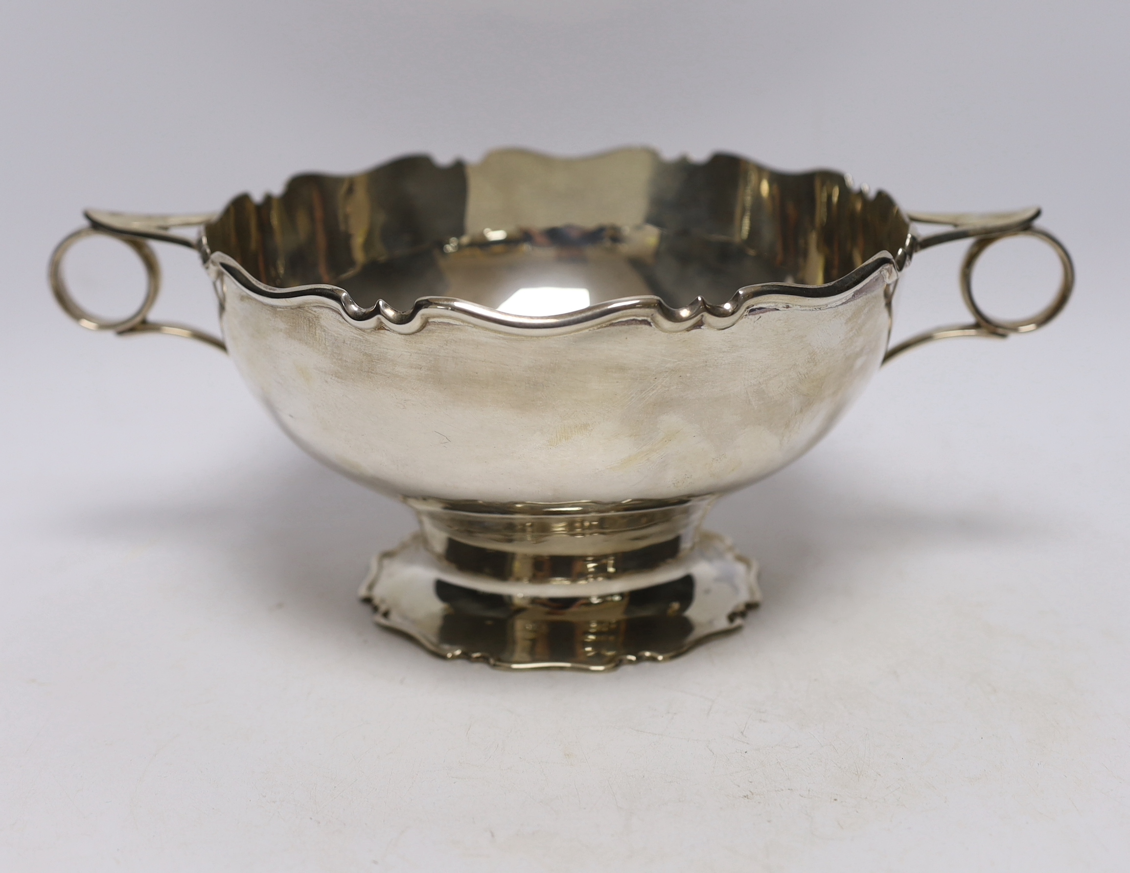 A George V silver two handled fruit bowl, by Atkin Brothers , Sheffield, 1919, 31cm over handles, 20oz.                                                                                                                     
