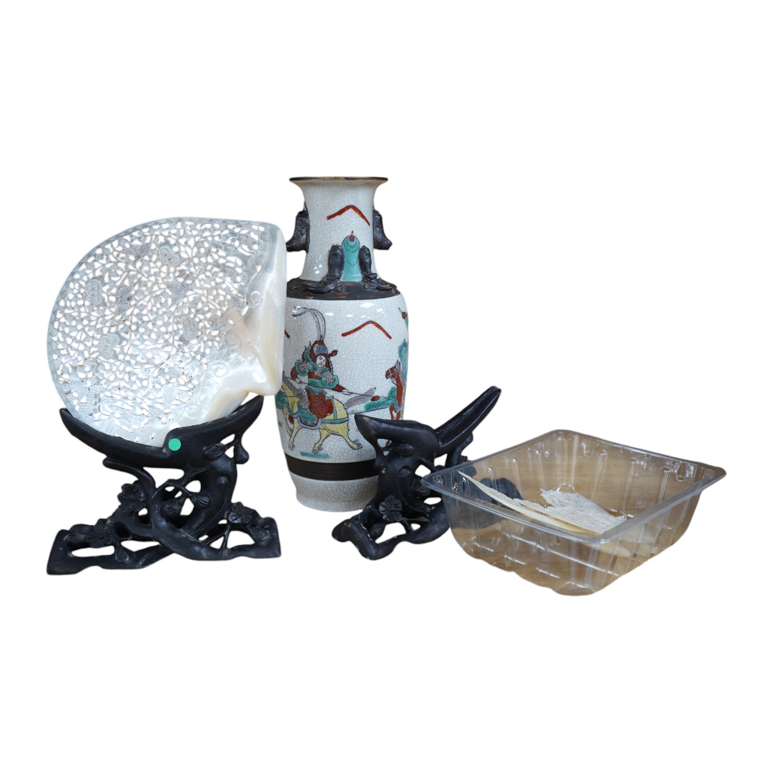 An early 20th century Chinese crackleglaze vase and a pair of mother of pearl carvings and stands. Condition - one carving in two pieces                                                                                    