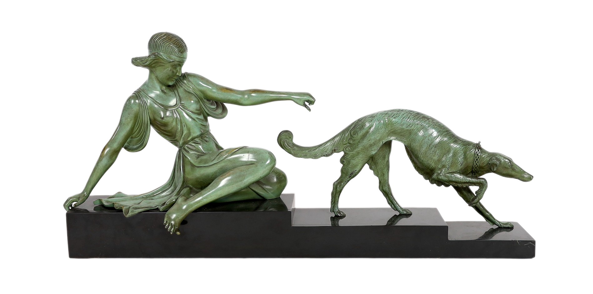 Armand Godard. A French Art Deco patinated bronze and black marble group of a classical woman and borzoi, 80cm wide, 37cm high                                                                                              
