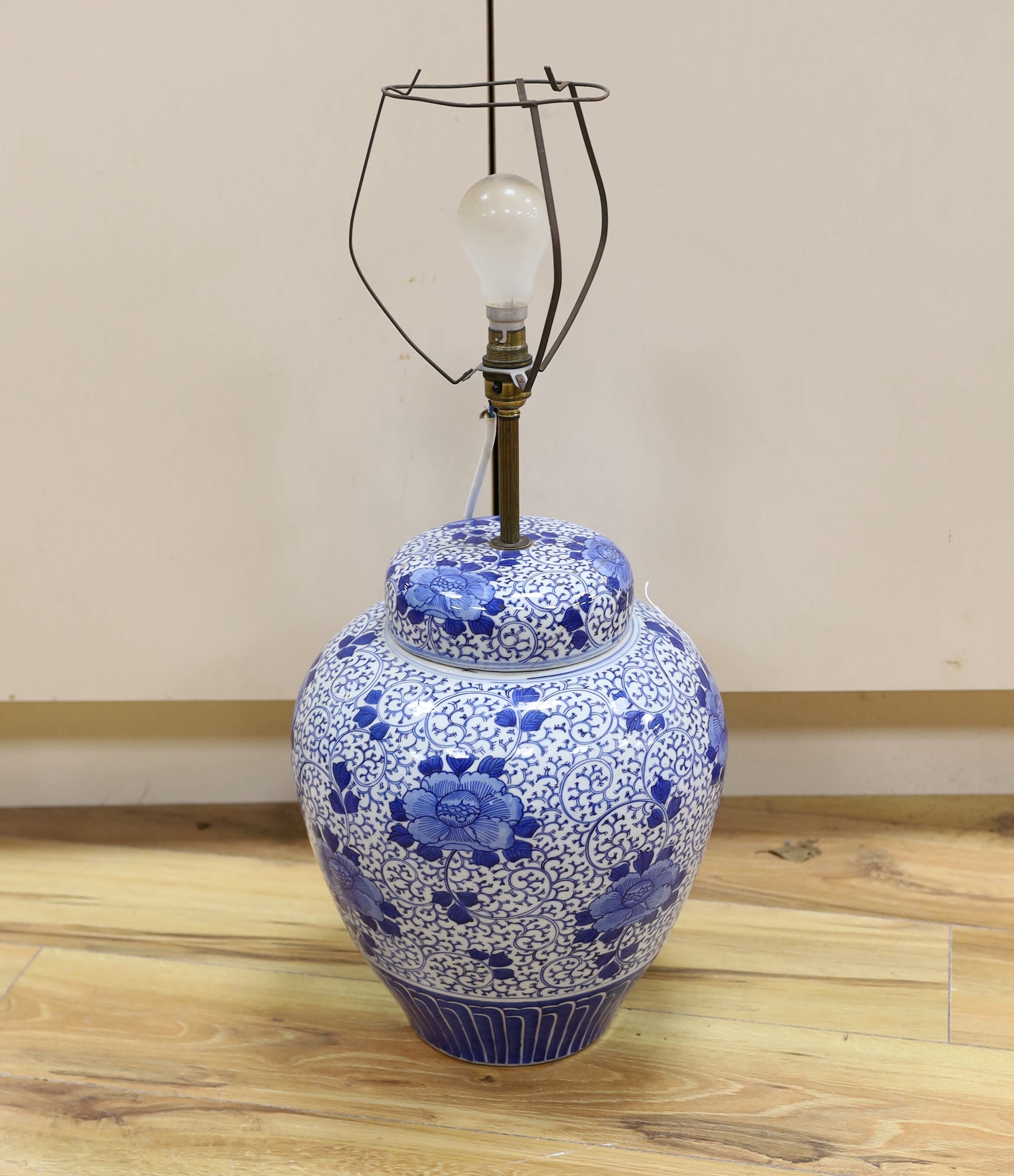 A Chinese blue and white jar and cover (converted to a desk lamp) (A/F), jar and cover 38 cm high                                                                                                                           