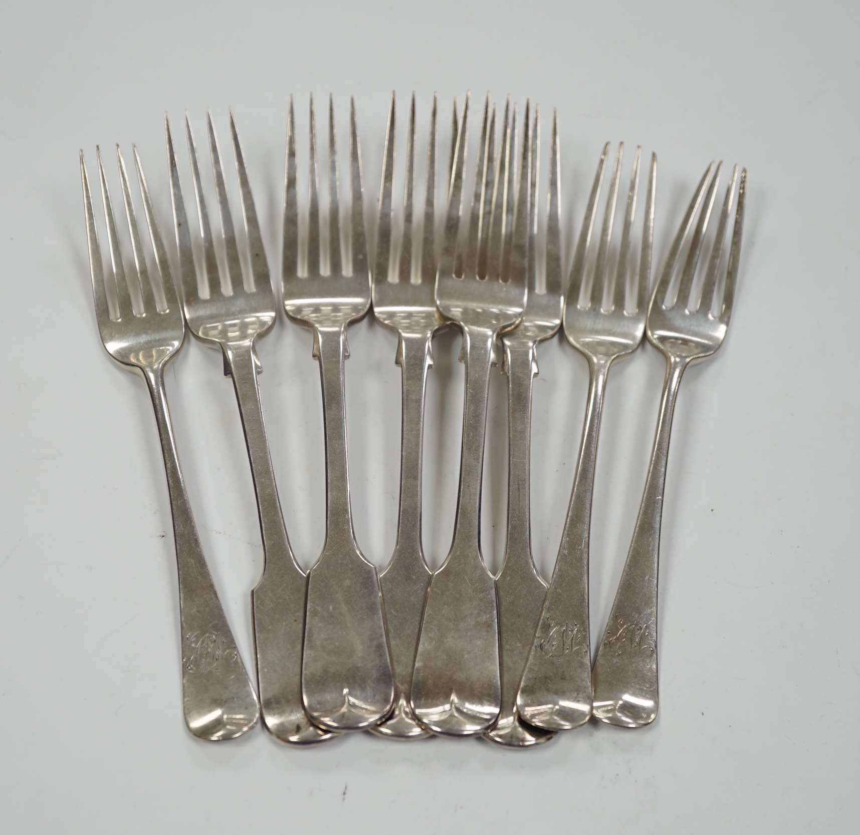 Five Victorian silver fiddle pattern dessert forks, London, 1854 and three George III silver dessert forks, 10.9oz.                                                                                                         