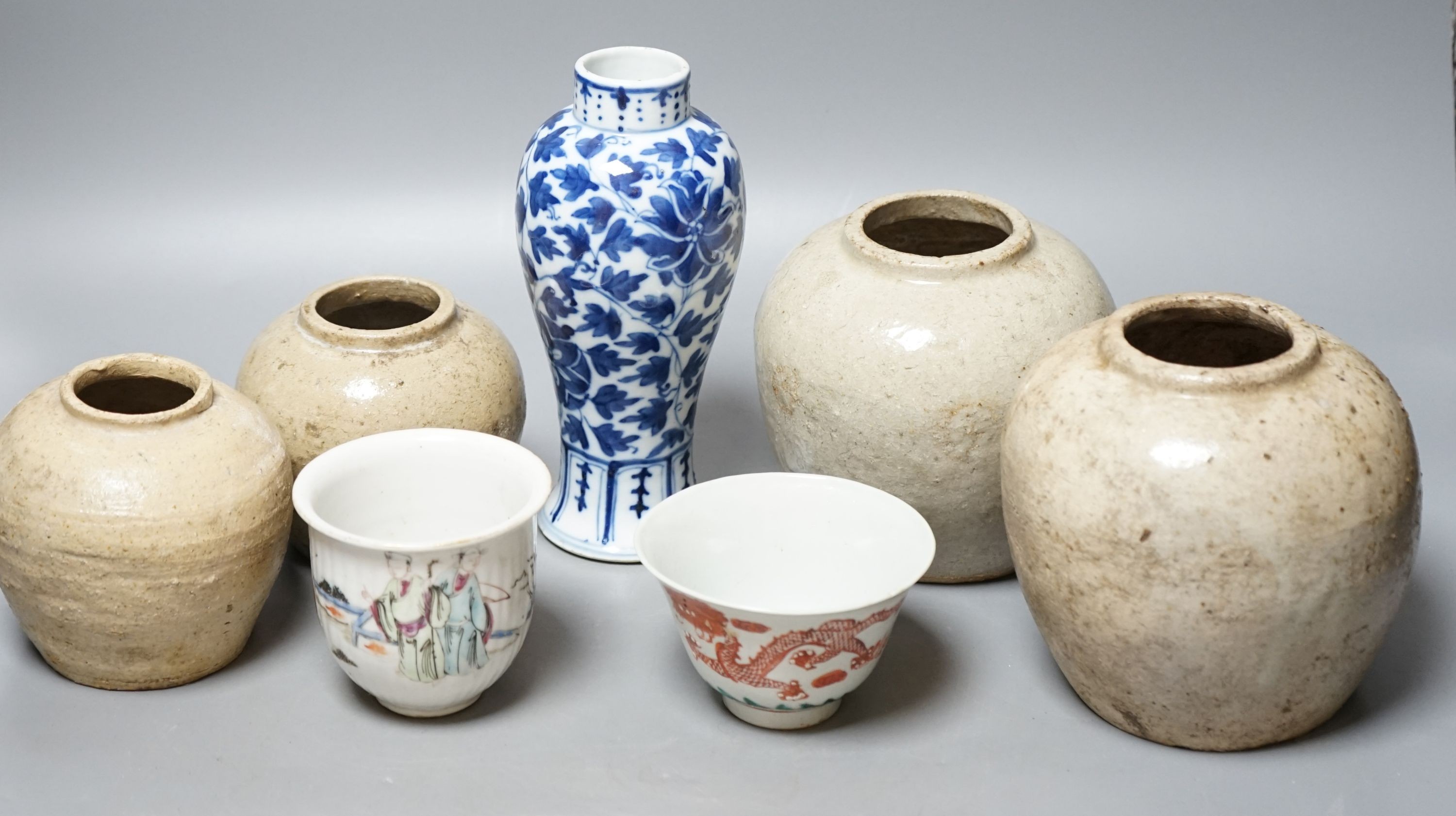 A Chinese blue and white vase, Xuande mark, c.1900, two late 19th Century Chinese cups and four Chinese provincial earthenware jars 19cm                                                                                    