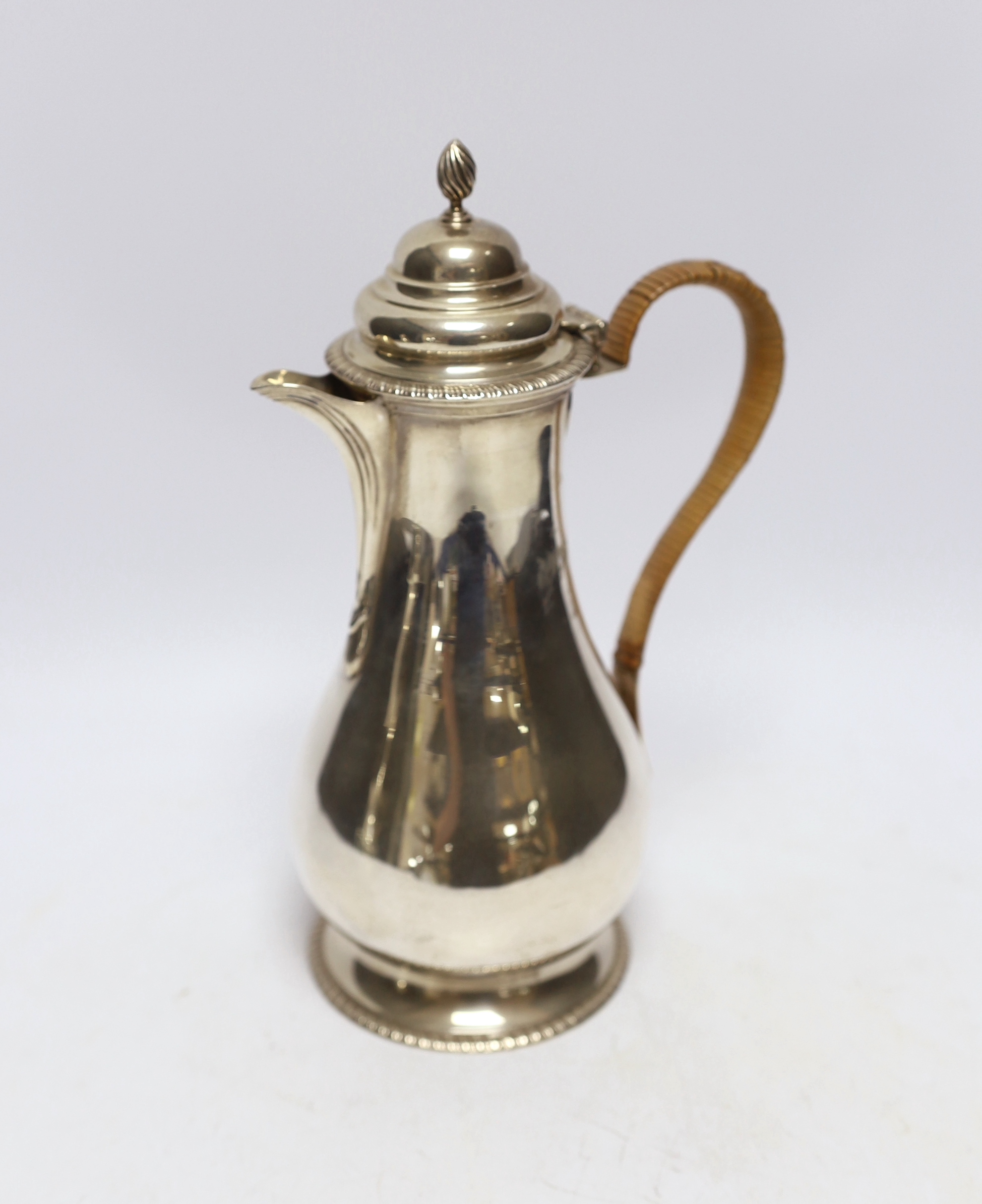 A George V silver baluster hot water pot by Mappin & Webb, London, 1919, height 25.5cm, gross weight 17.7oz.                                                                                                                