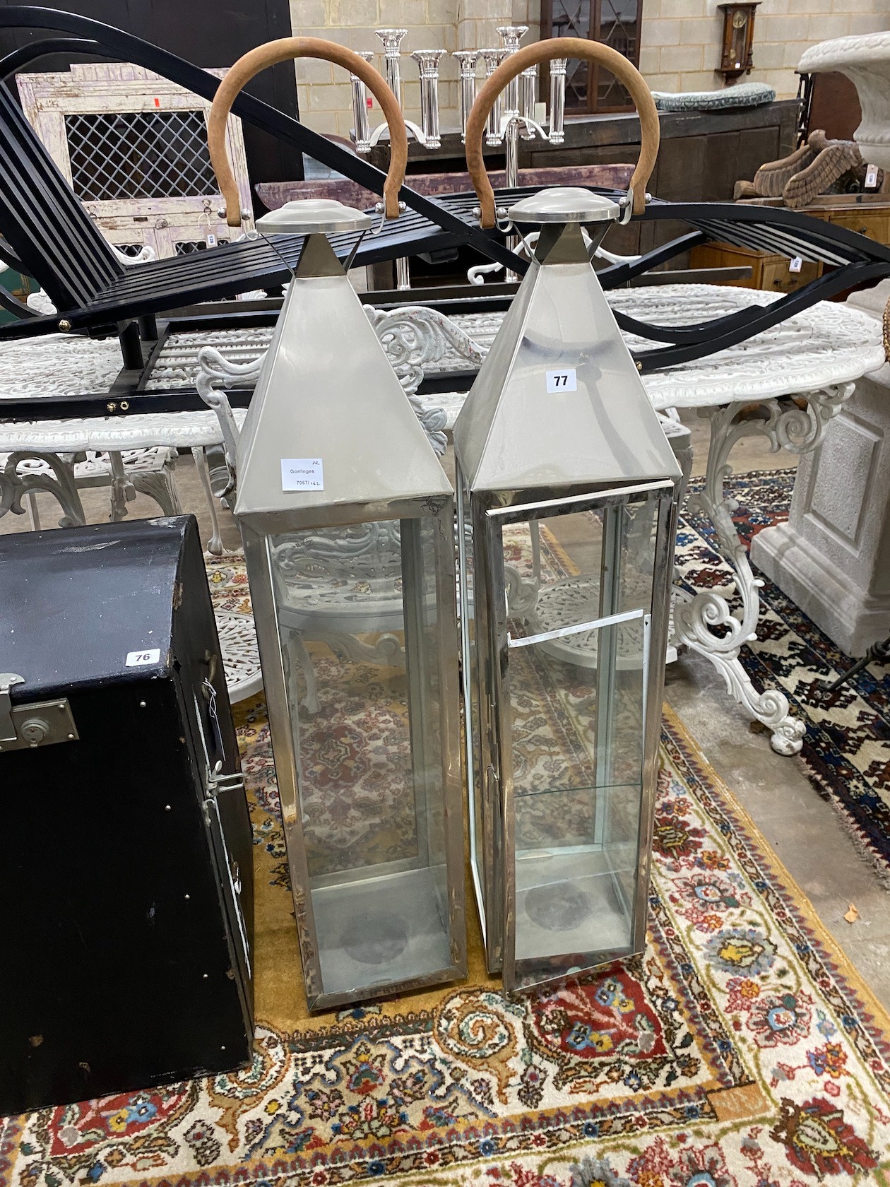 A pair of contemporary square metal and glass lanterns, height 115cm (one pane broken)                                                                                                                                      