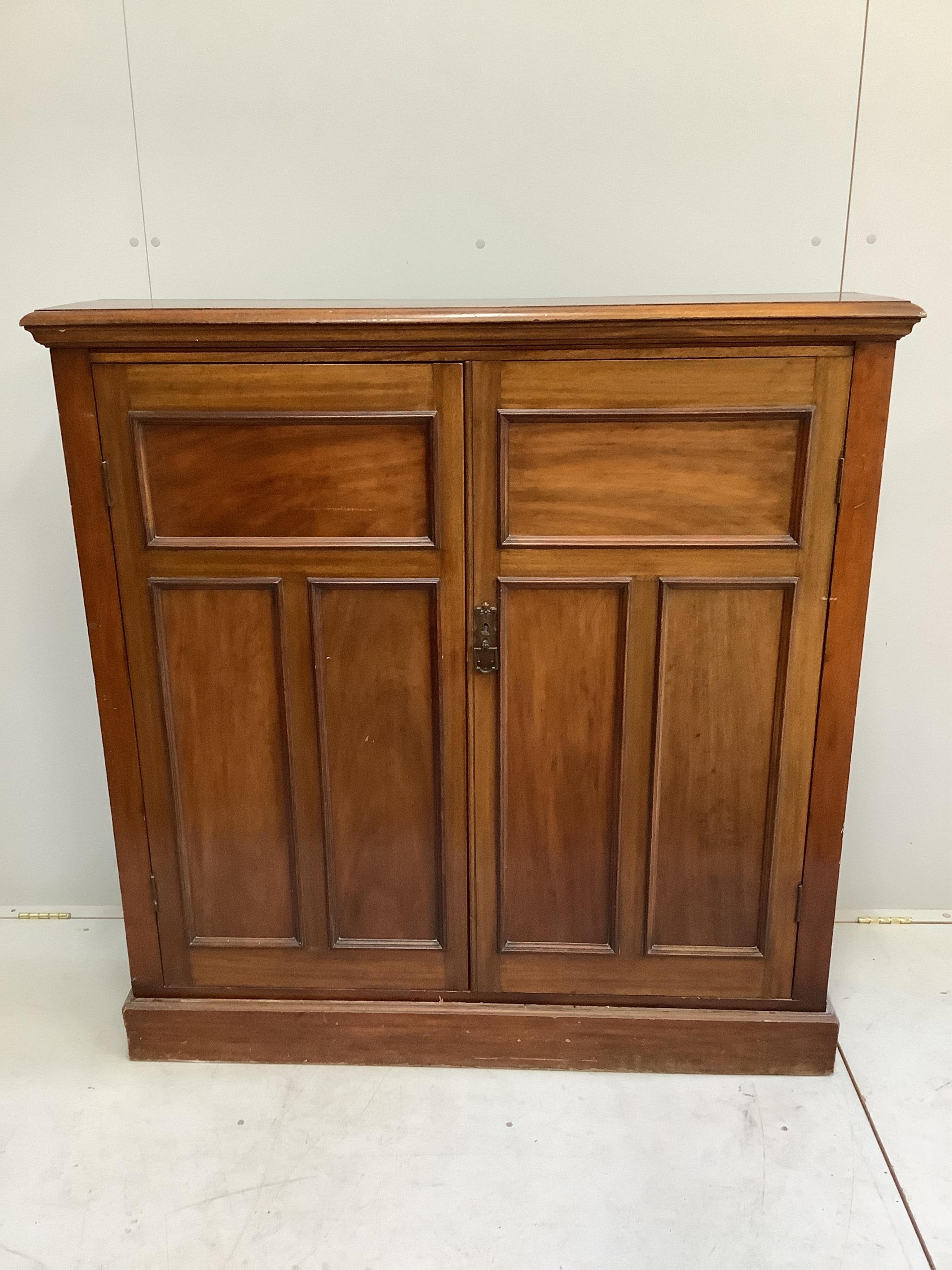 An Edwardian mahogany two door side cabinet, (loose plinth), width 124cm, depth 29cm, height 126cm                                                                                                                          
