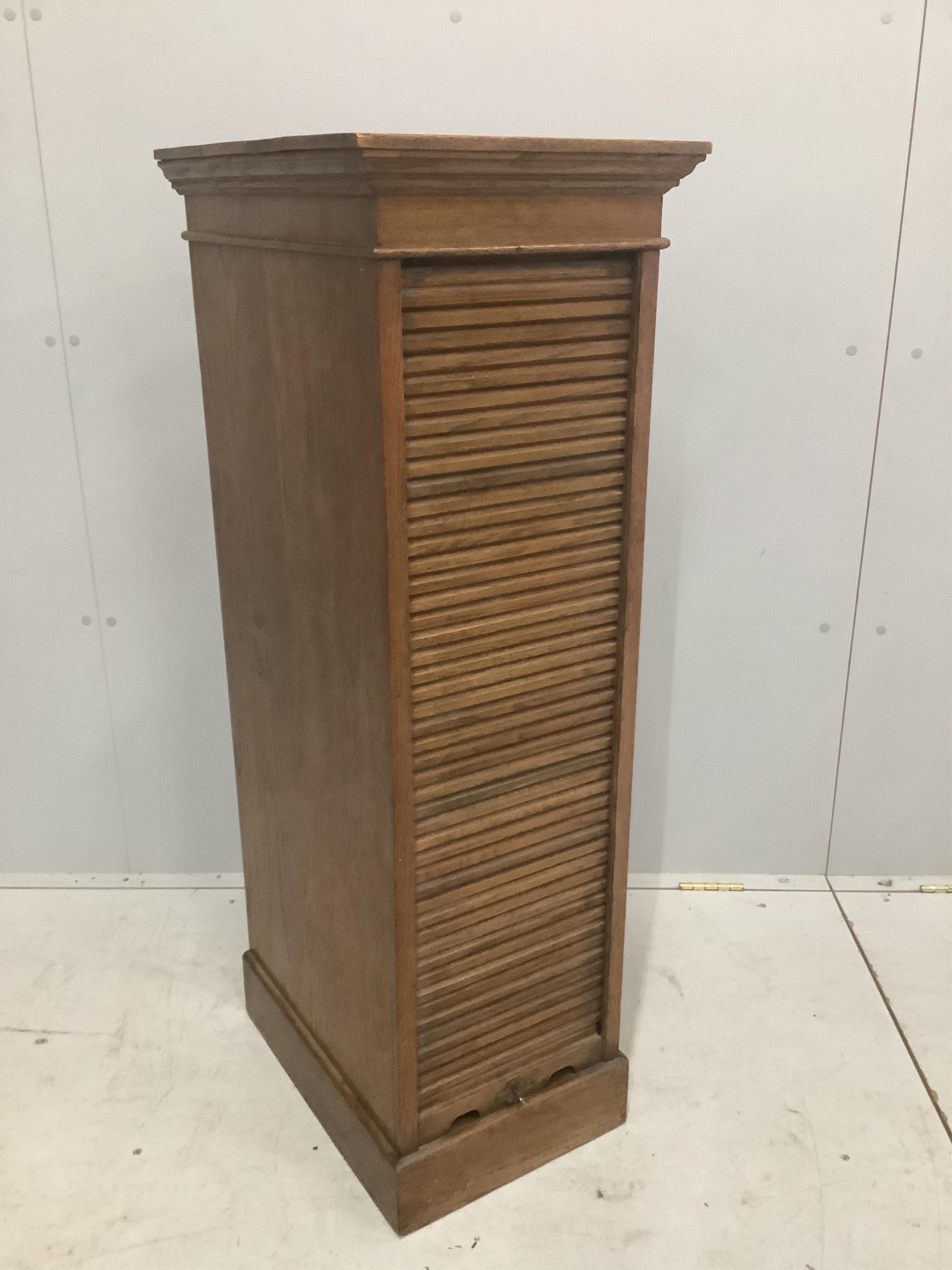 An early 20th century oak Lebus tambour filing cabinet, width 37cm, depth 49cm, height 116cm. Condition - poor to fair                                                                                                      