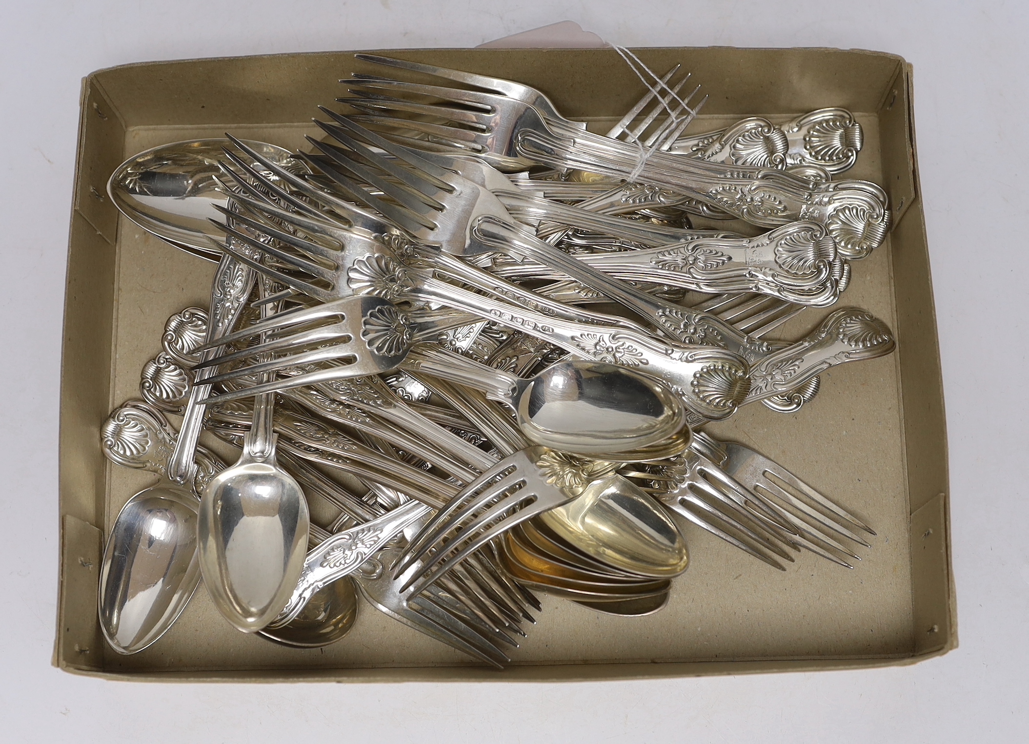 A part canteen of Victorian silver King's pattern flatware by George Adams, comprising twelve table forks, twelve dessert spoons, six dessert forks, one sauce ladle and four serving spoons, London, 1854, together with fo