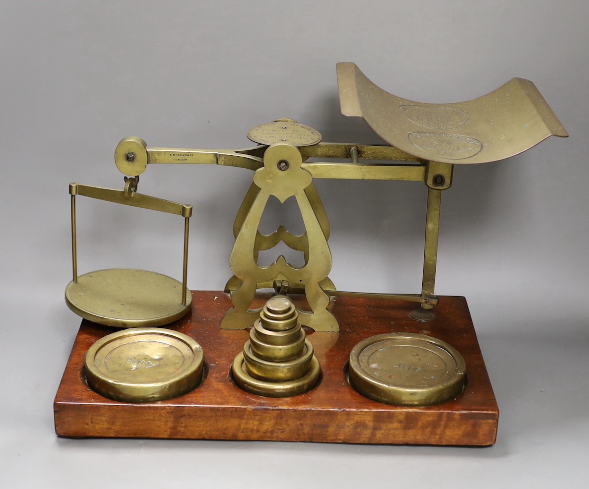 Victorian brass postal scales by S. Mordan & Co. of London, on a mahogany plinth, 45cm wide                                                                                                                                 