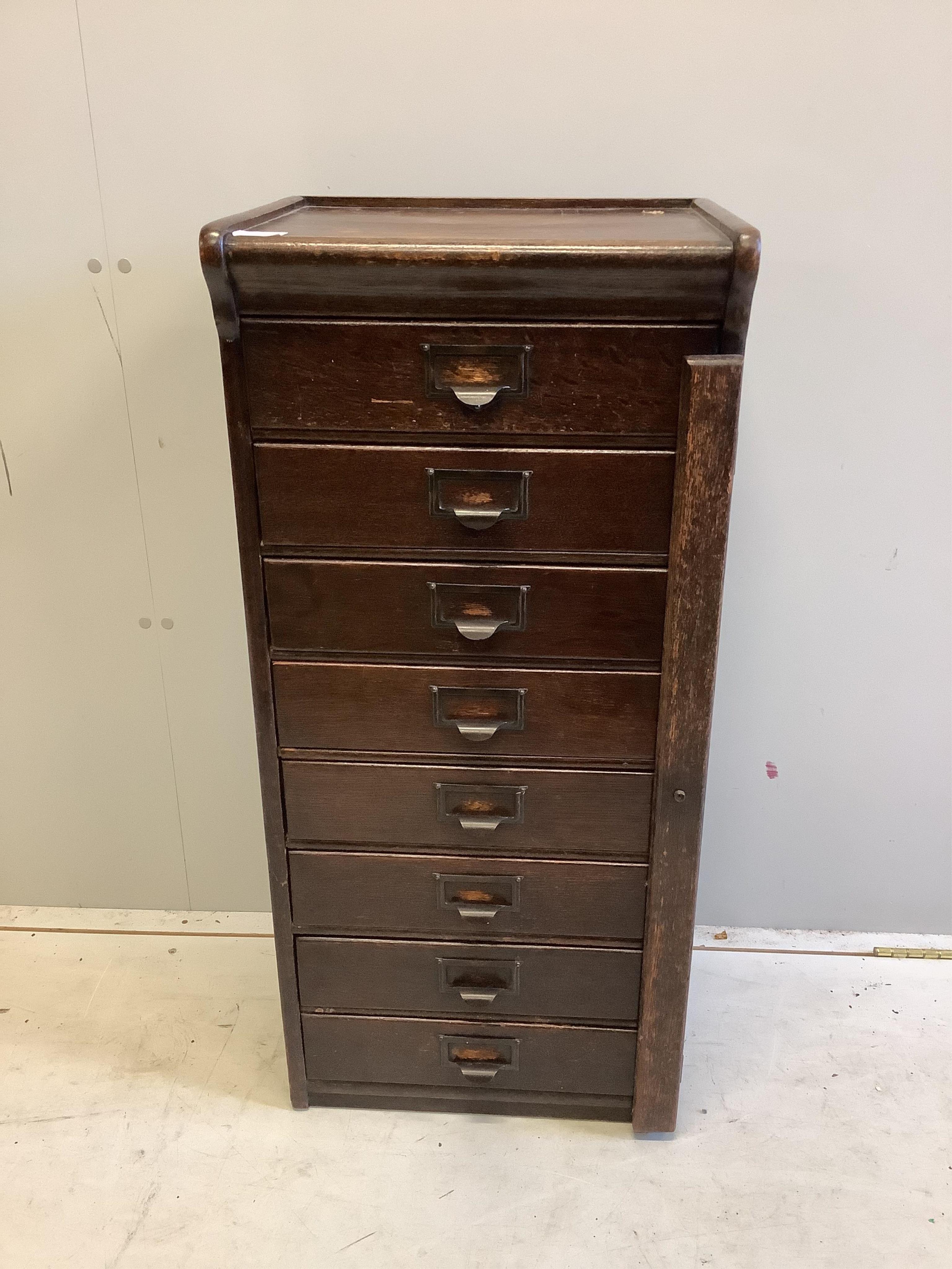 A Globe Wernicke oak eight drawer filing cabinet, width 44cm, depth 34cm, height 97cm. Condition - fair                                                                                                                     