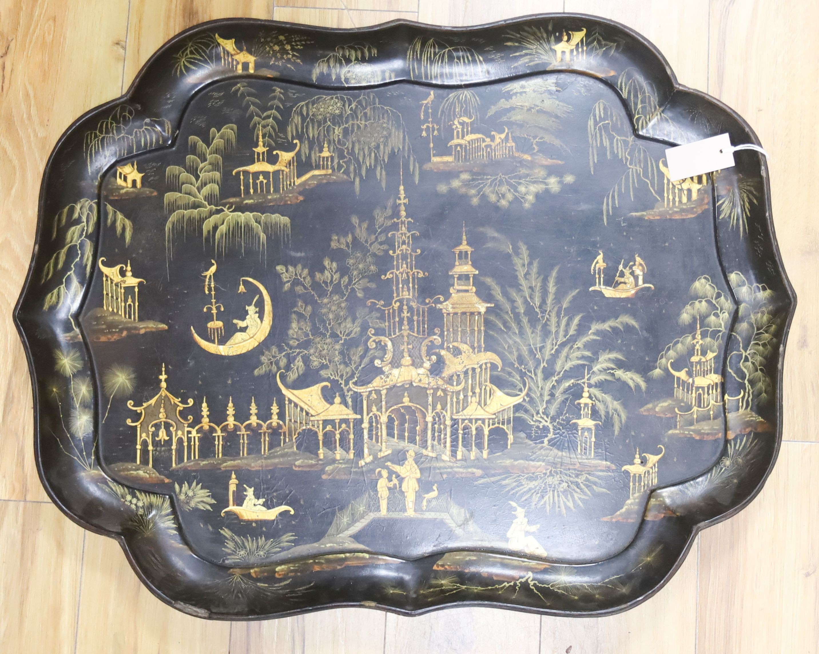 A late Regency black-lacquered papier mache tray, 80cm                                                                                                                                                                      