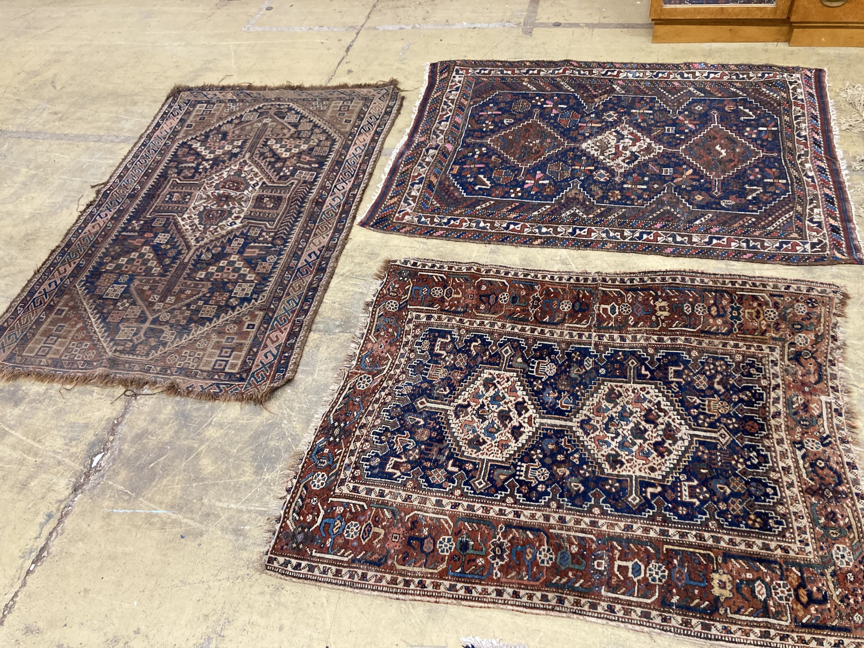 Three antique Caucasian blue ground rugs, largest 154 x 114 cms.                                                                                                                                                            