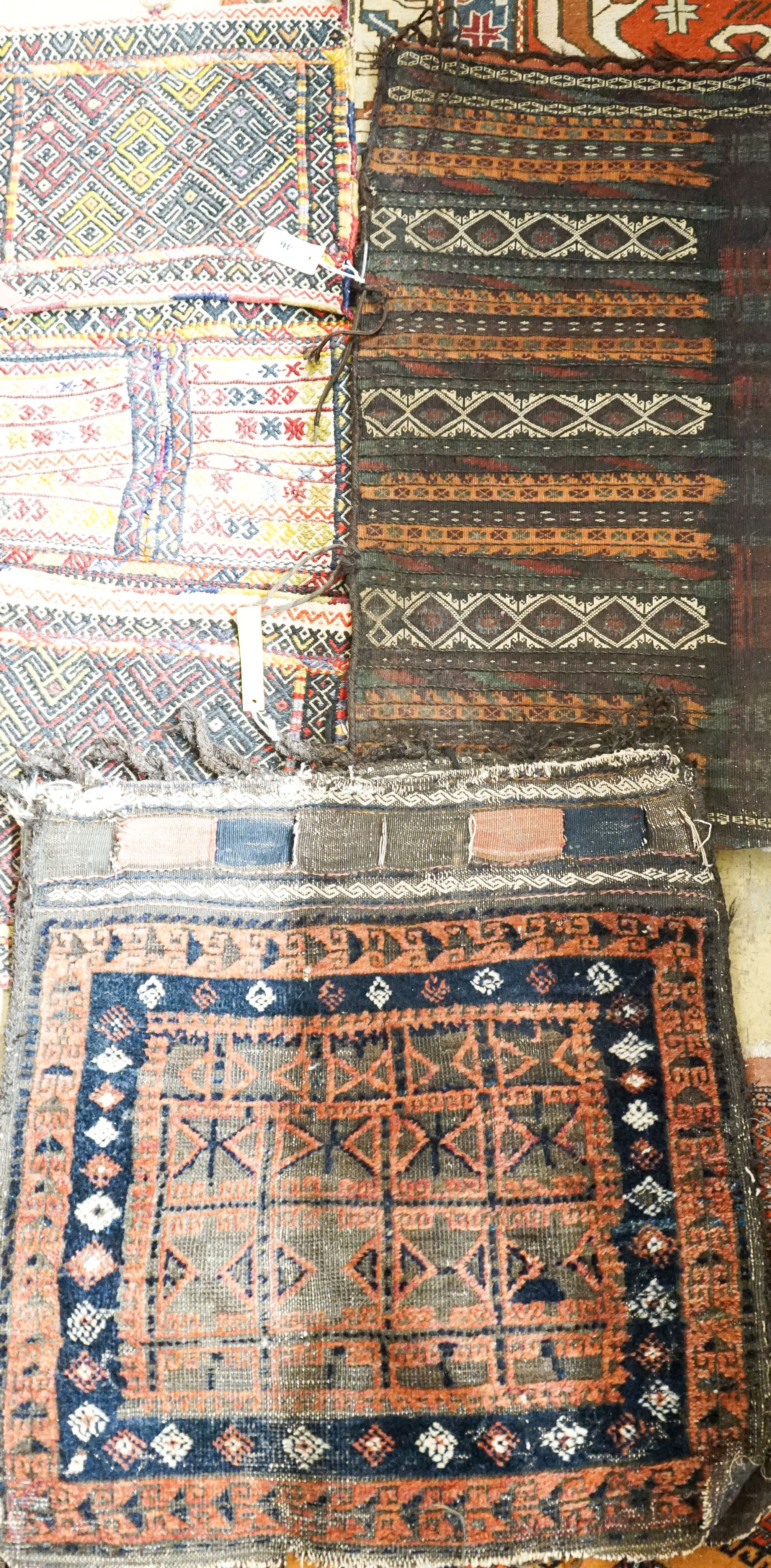 Three Belouch / Afghan saddle bags largest 116 x 44 cms.                                                                                                                                                                    