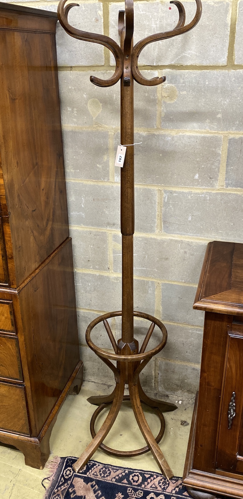 A beech bentwood coat and stick stand, height 179cm                                                                                                                                                                         