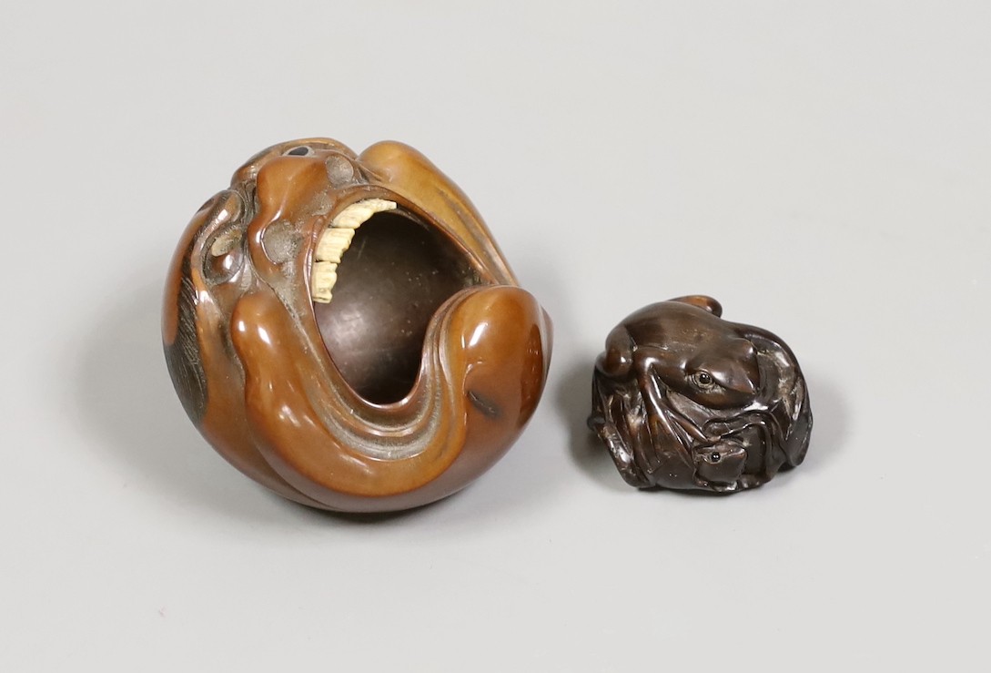 A Japanese mask nut carving wood carving, Meiji period and a netsuke of frogs, marks to bases, largest 7.5cm wide                                                                                                           