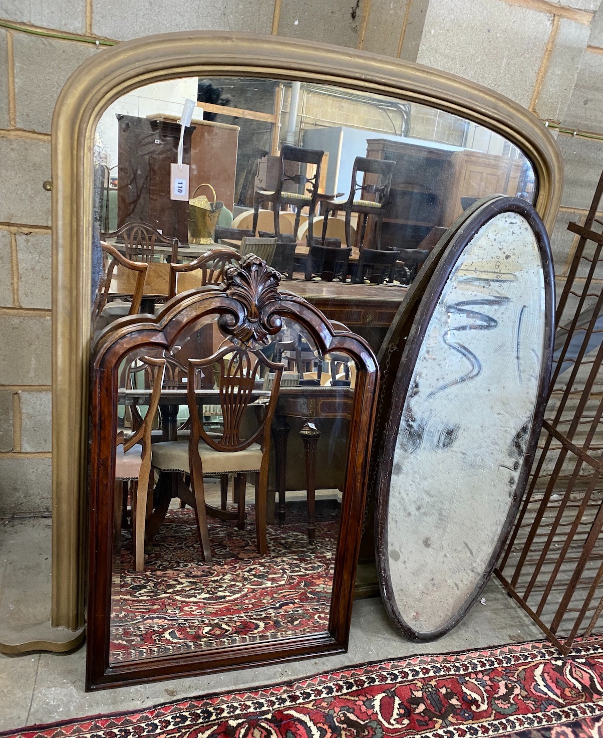 A Victorian giltwood overmantel mirror, width 150cm, height 150cm together with two later wall mirrors                                                                                                                      