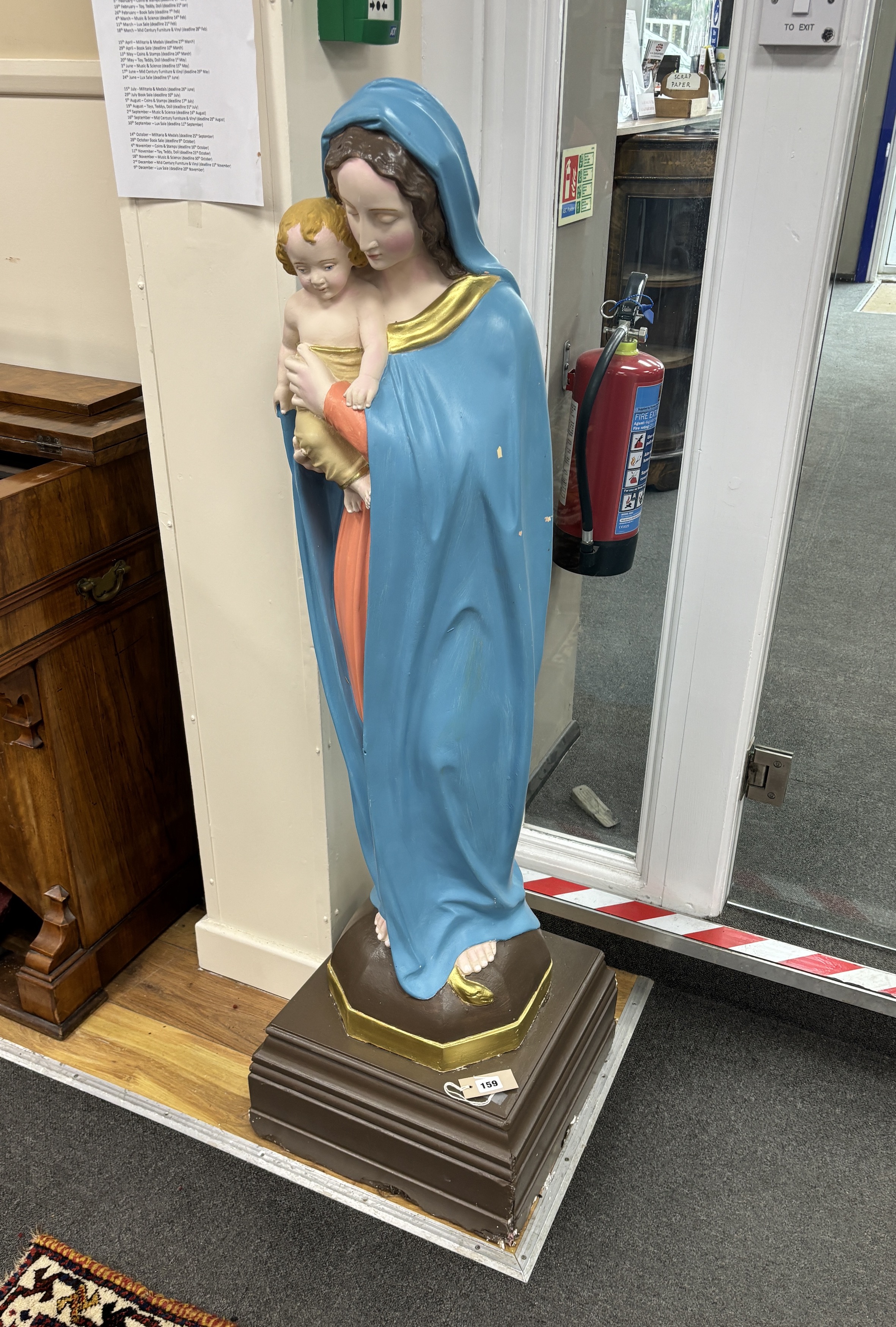 A large painted plaster floor standing statue of Madonna and child, height 130cm                                                                                                                                            