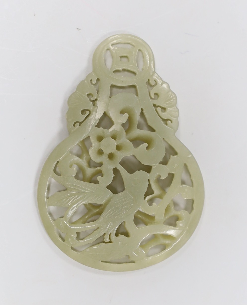 A Chinese celadon jade reticulated pendant. 7cm tall                                                                                                                                                                        