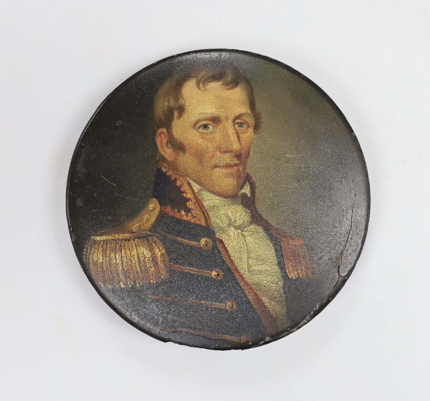 A 19th century papier mache box with a painting of a 19th century naval officer, 12cm diameter                                                                                                                              