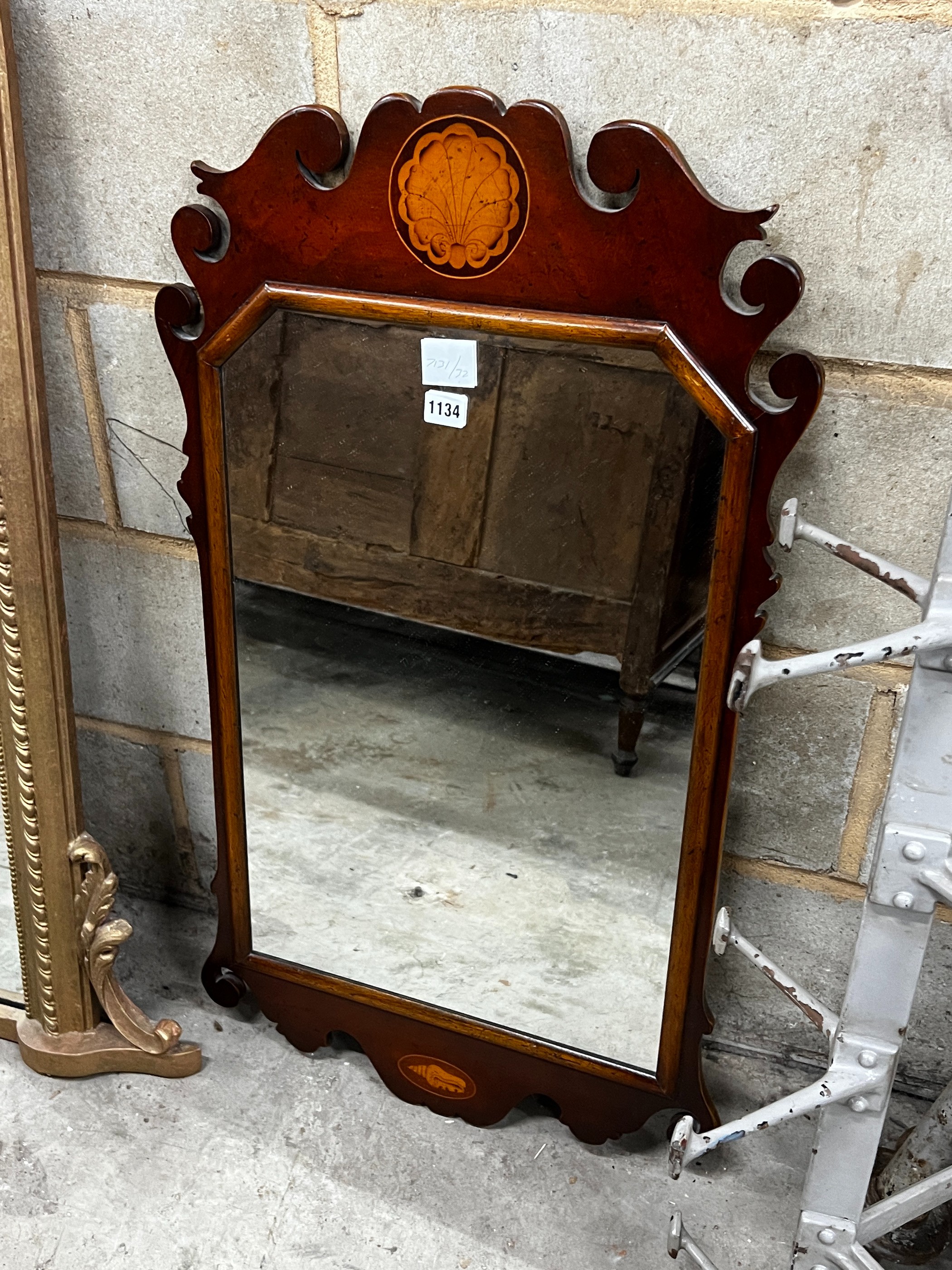 A George III style mahogany fret cut wall mirror, width 52cm, height 90cm                                                                                                                                                   