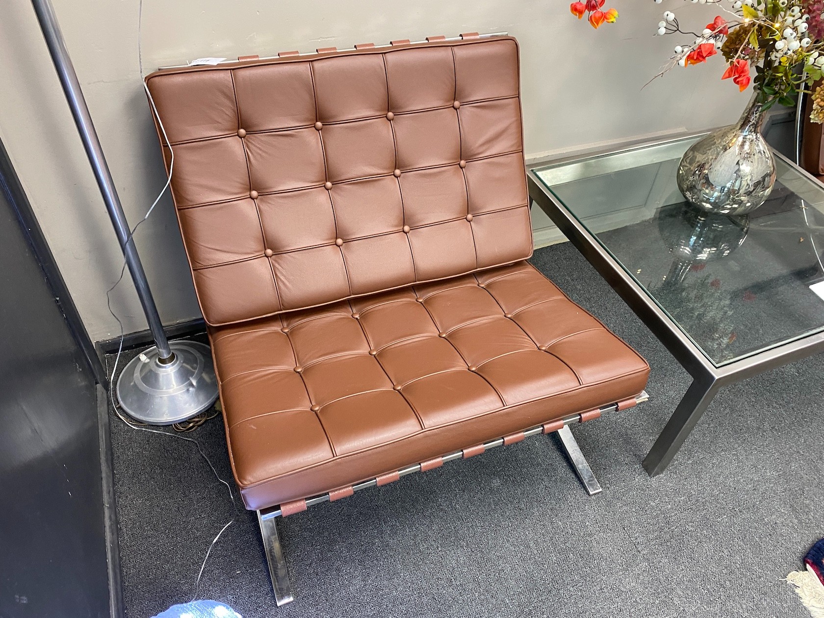 A pair of Barcelona style brown leather and chrome chairs, width 76cm, depth 78cm, height 73cm                                                                                                                              