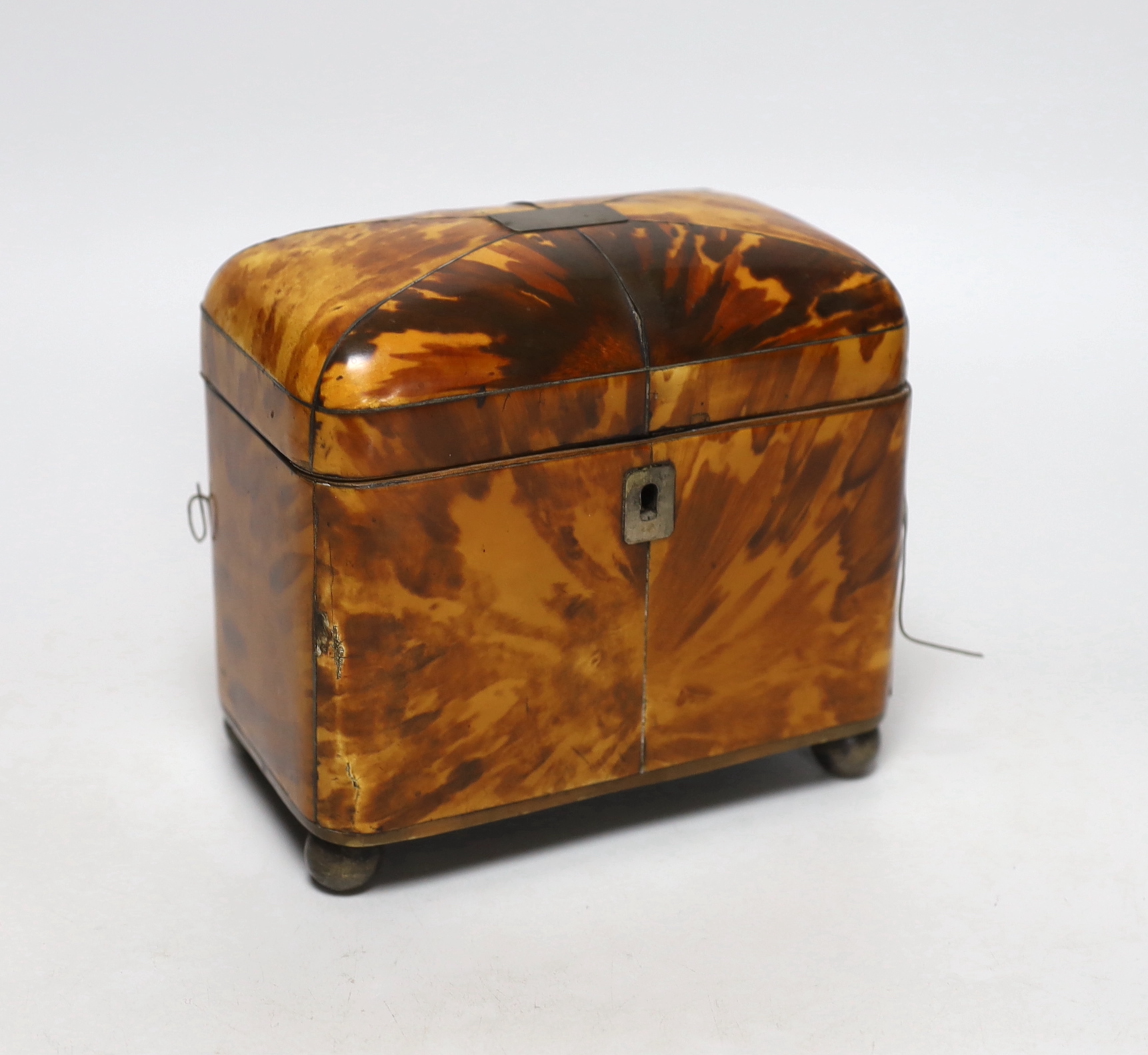 A George III tortoiseshell tea caddy with white metal mounts, 15cm wide                                                                                                                                                     