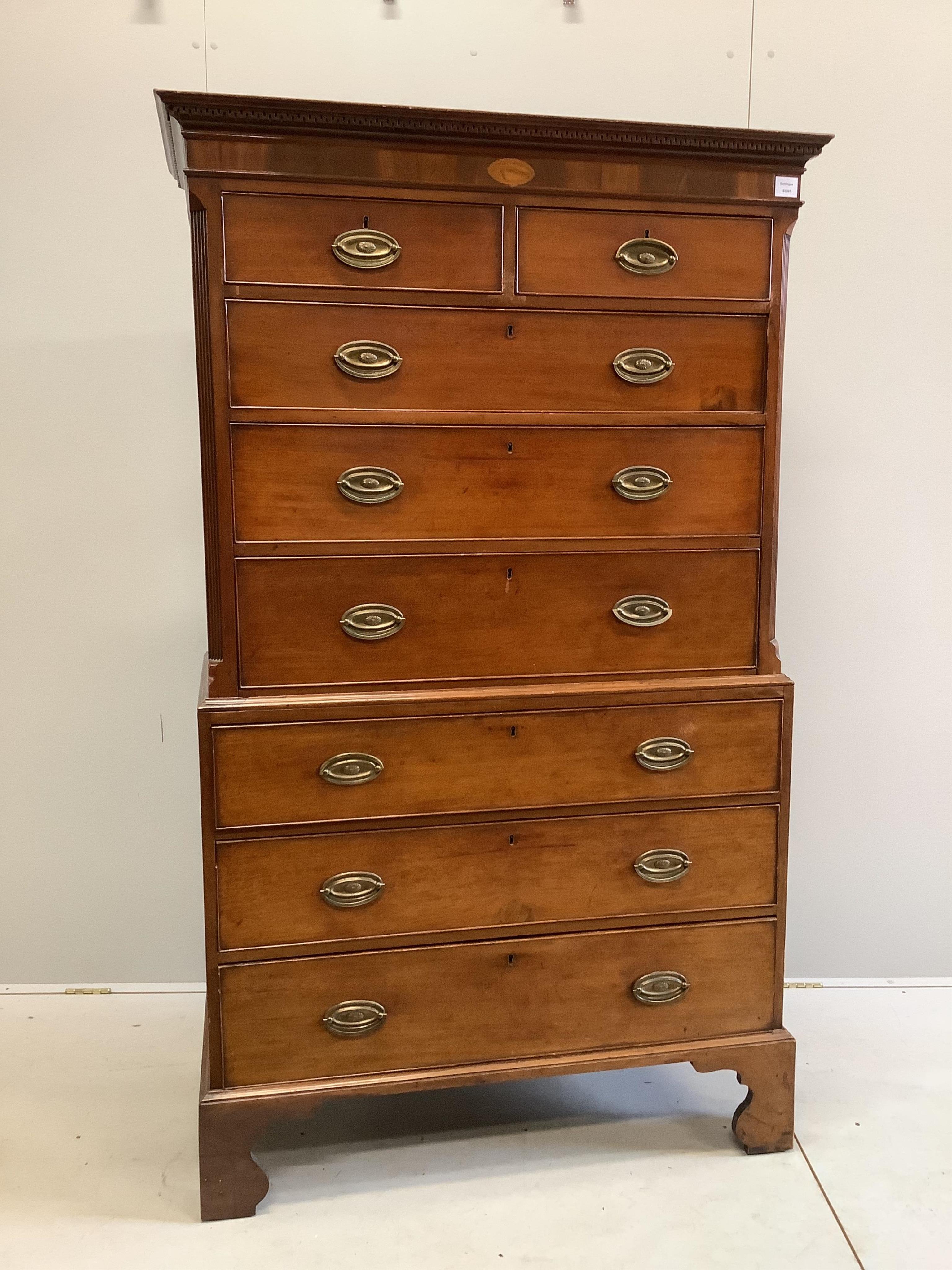 A George III inlaid mahogany chest on chest, width 106cm, depth 50cm, height 185cm. Condition - fair                                                                                                                        