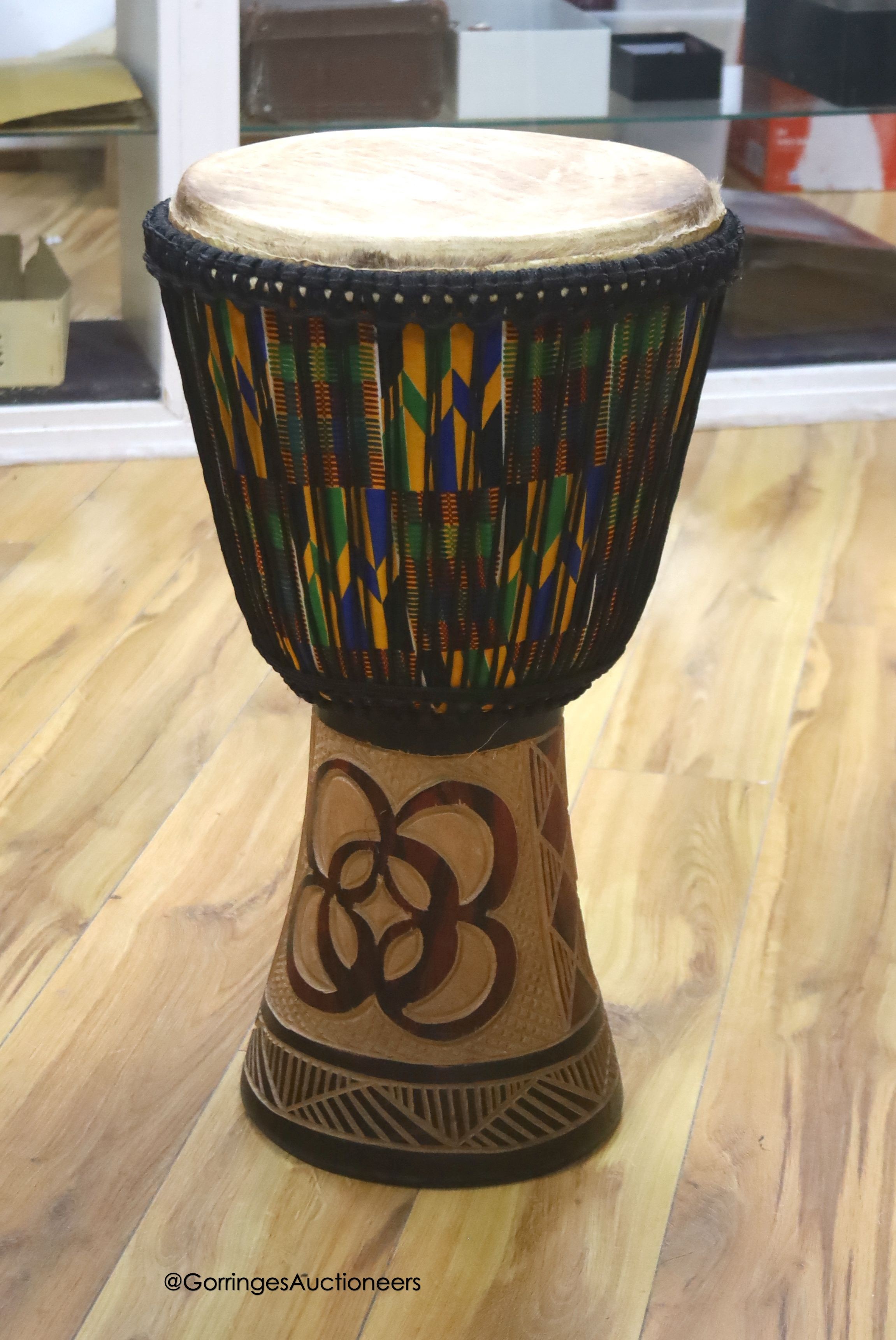 A Ghanian Djembe drum, height 62cm                                                                                                                                                                                          