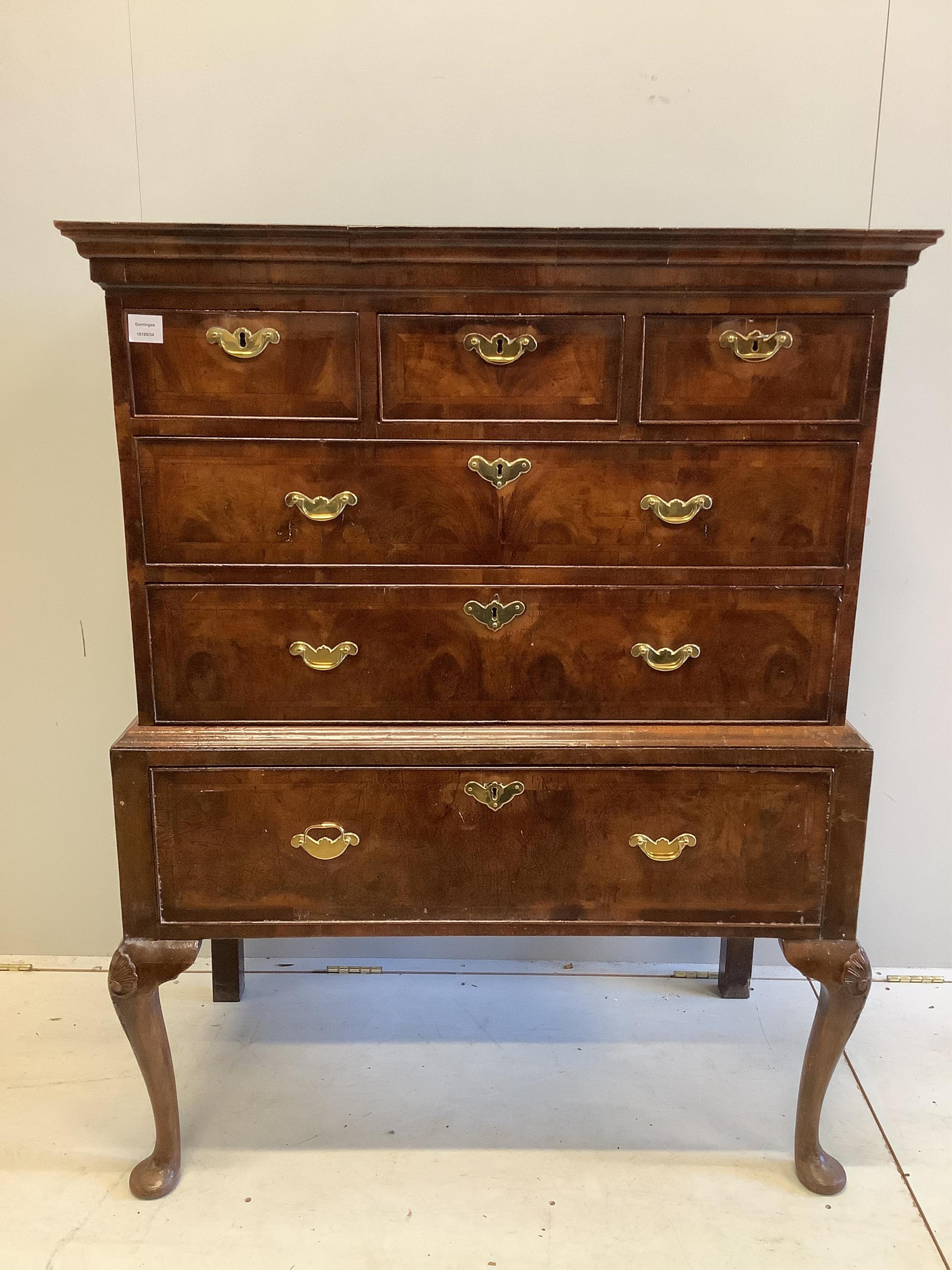 A George II walnut chest on stand, width 104cm, depth 56cm, height 133cm. Condition - fair                                                                                                                                  