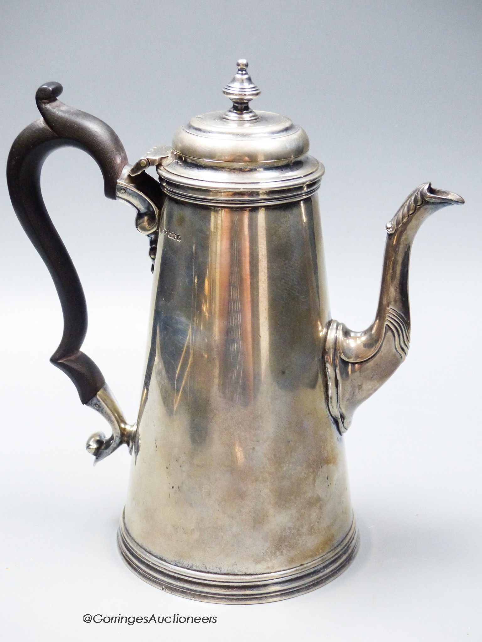 A George V 18th century style silver coffee pot, Henry Stratford Ltd, Sheffield, 1910, height 22.5cm, gross 25.5oz.                                                                                                         