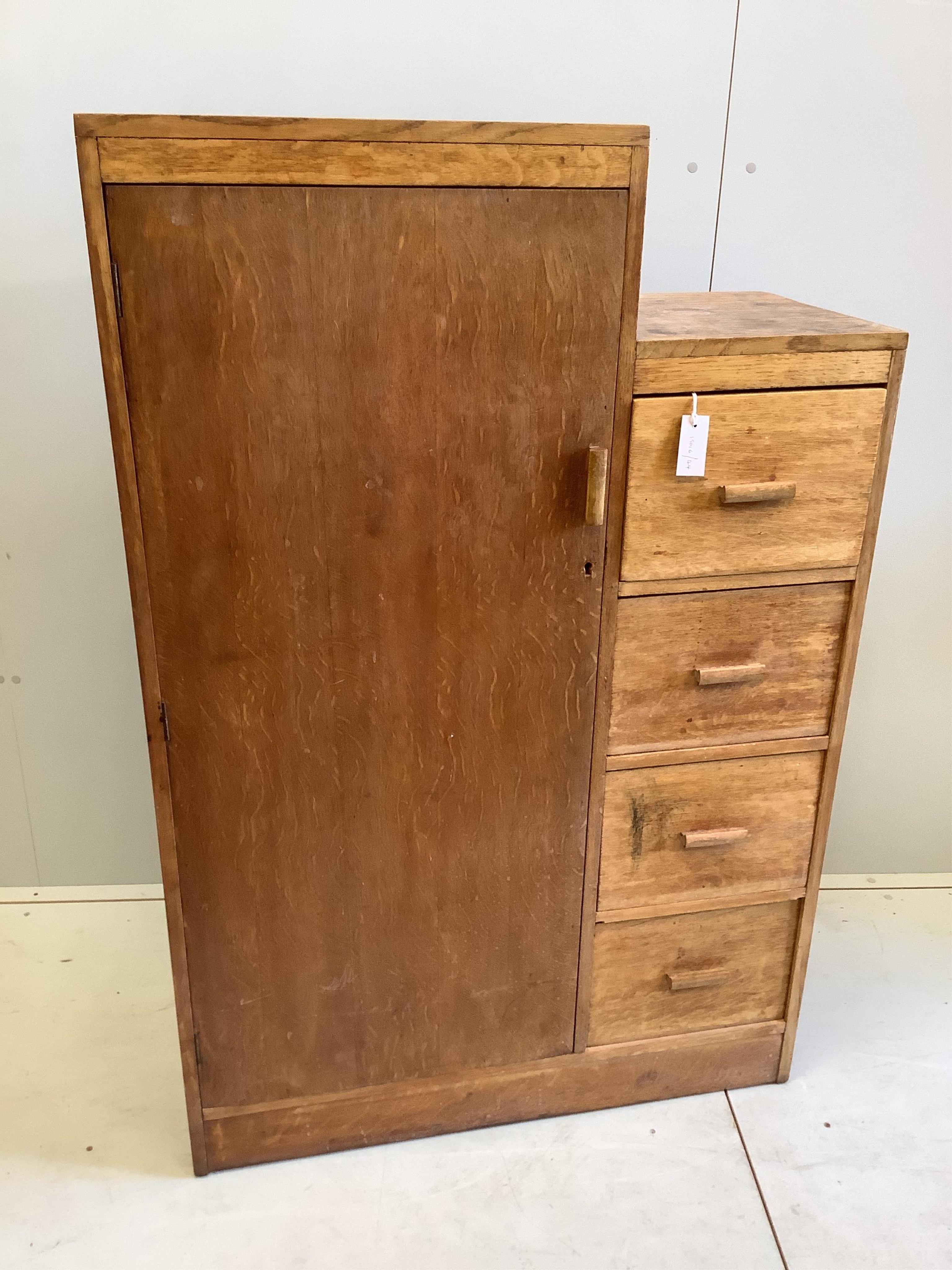 A Heals style light oak small compactum wardrobe, width 91cm, depth 40cm, height 138cm. Condition - poor to fair                                                                                                            