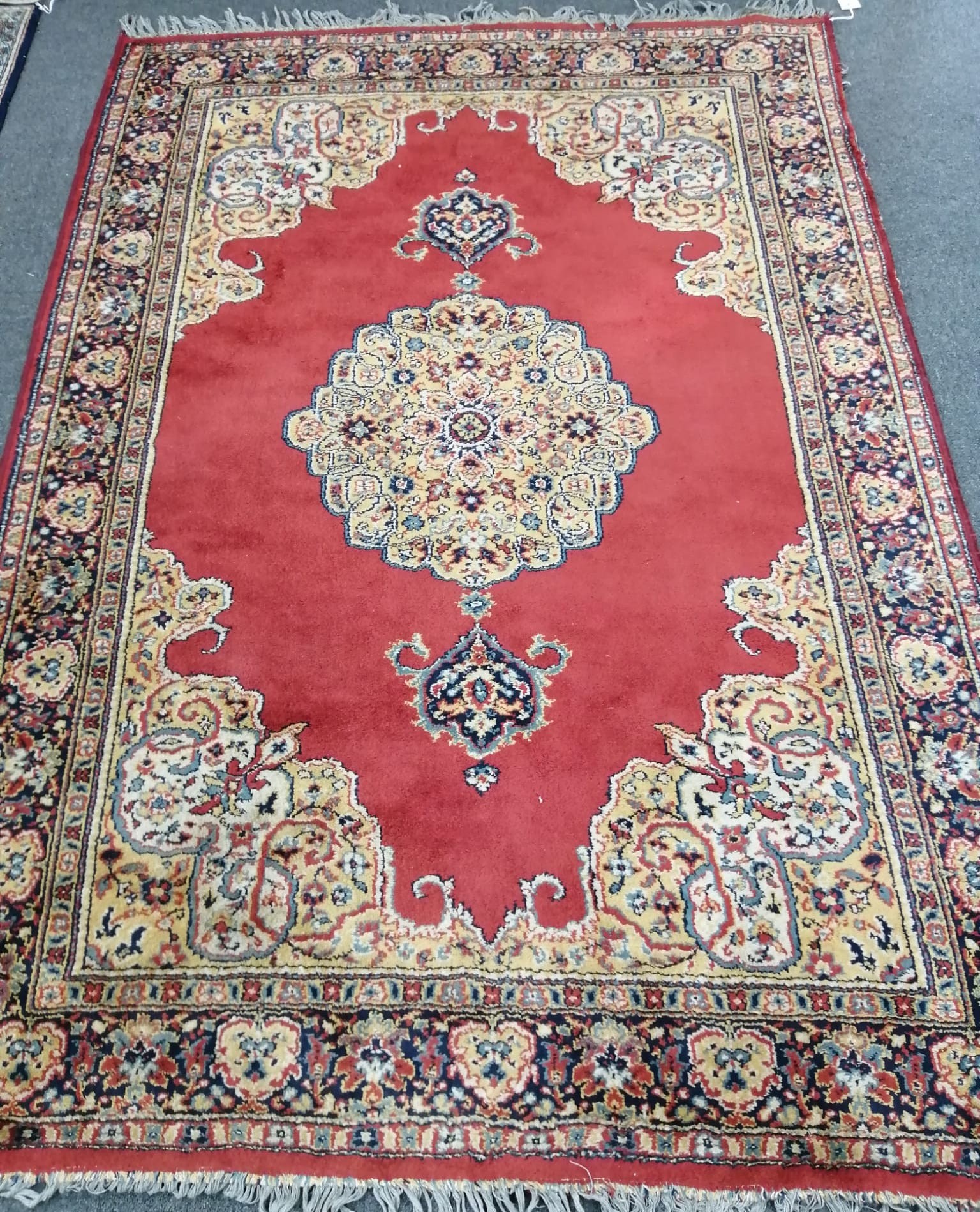 A Belgian machined red ground rug, in Kerman style, 190 x 131cm                                                                                                                                                             