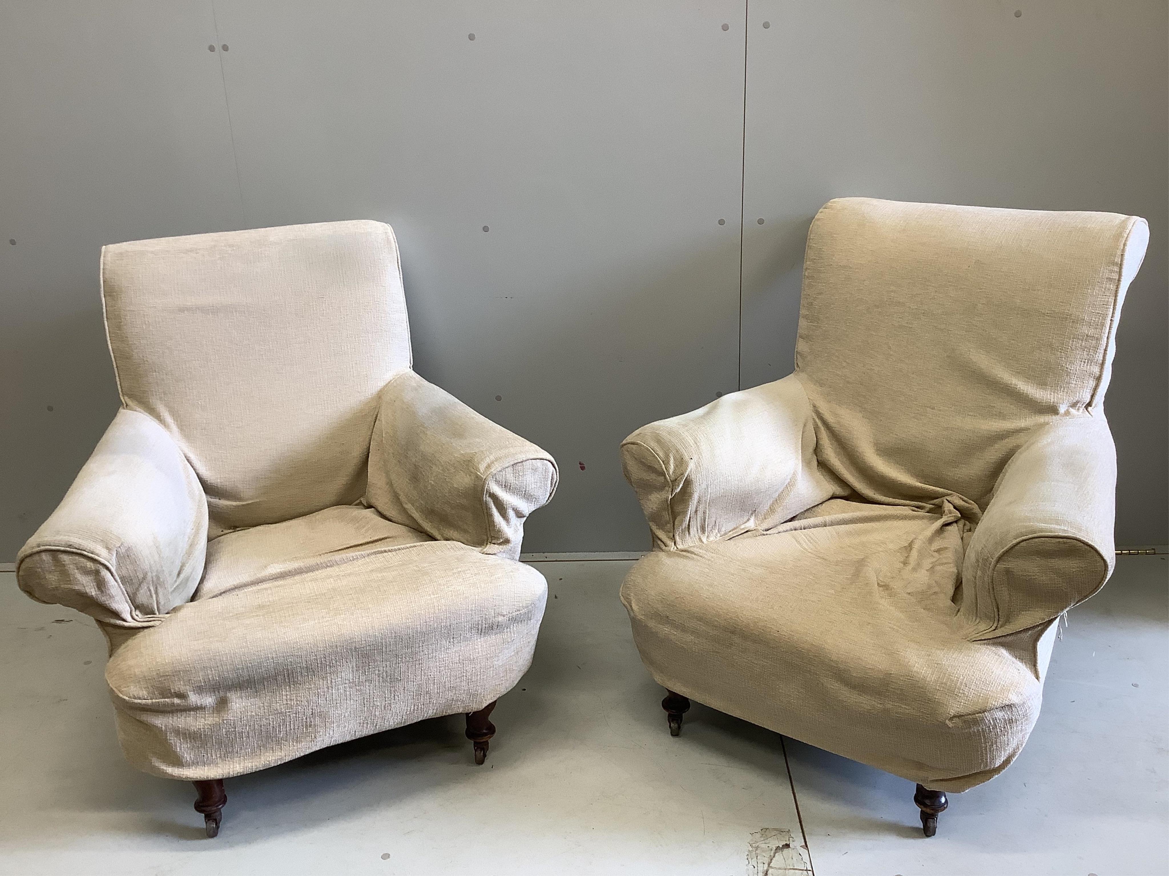 A pair of early 20th century Howard style upholstered armchairs, width 90cm, depth 86cm, height 93cm. Condition - one poor, one fair                                                                                        