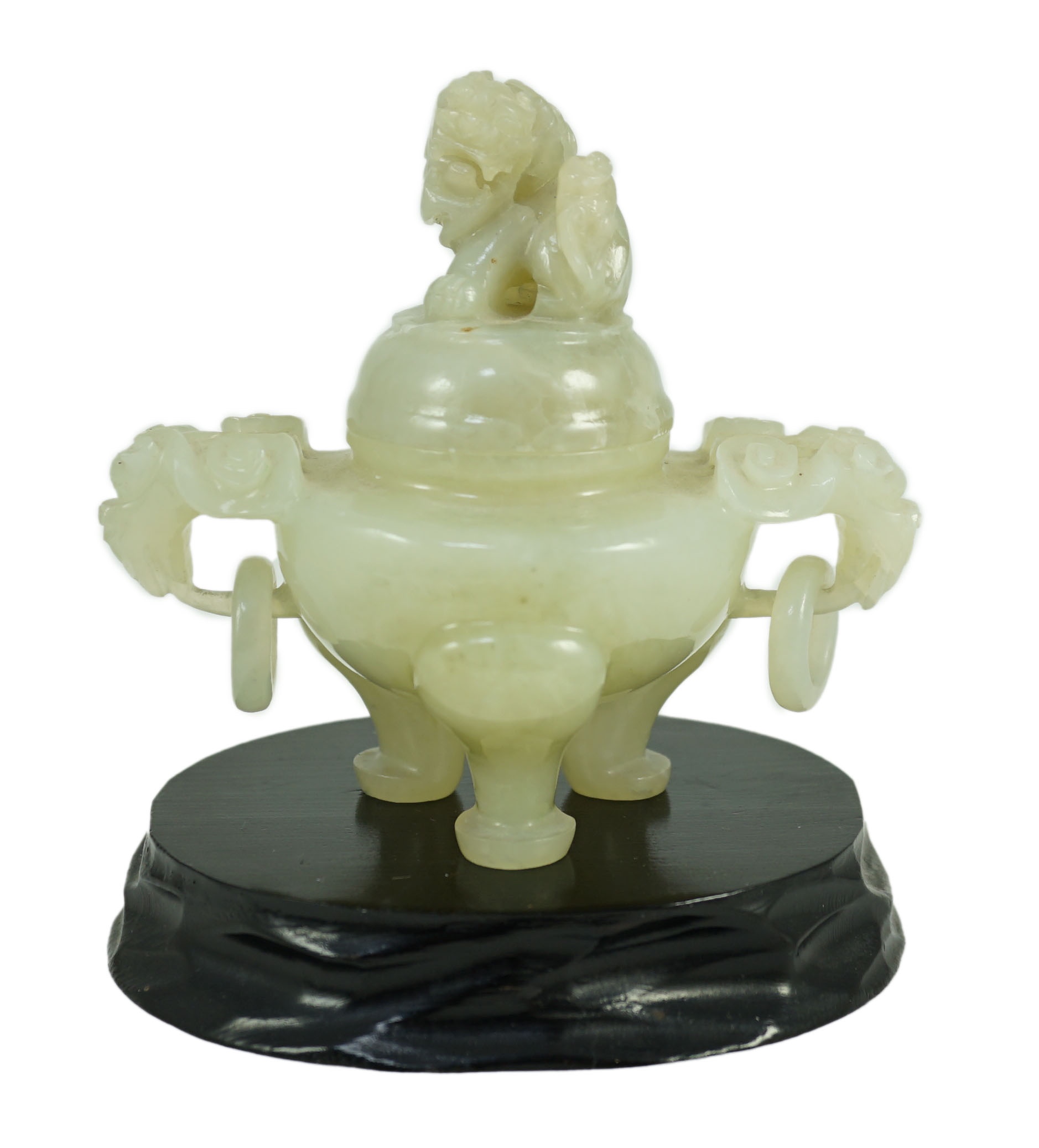 A Chinese pale celadon jade tripod censer cover, 20th century, 12cm wide, wood stand                                                                                                                                        