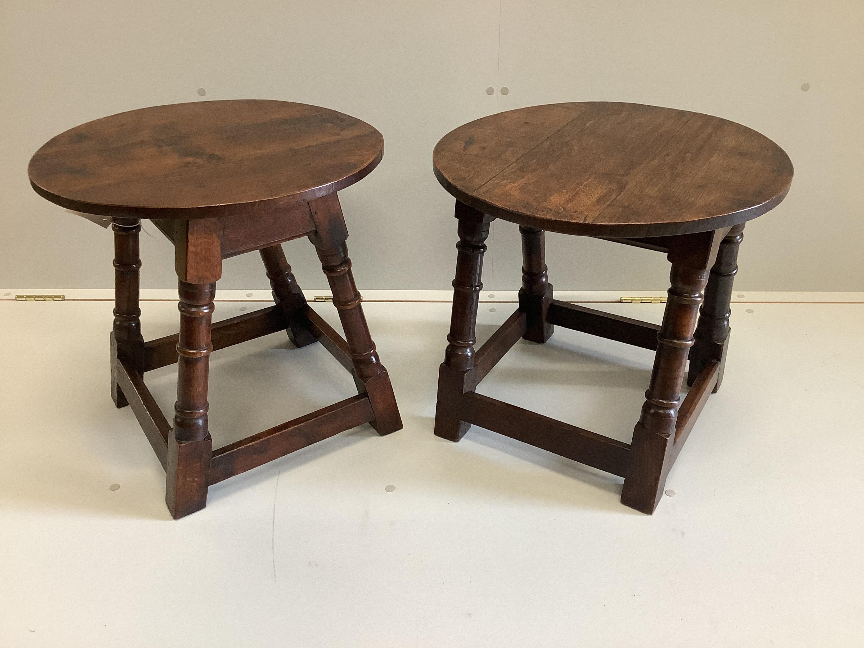 A near pair of early 20th century 18th century style circular oak occasional tables, 50cm diameter, height 48cm.                                                                                                            