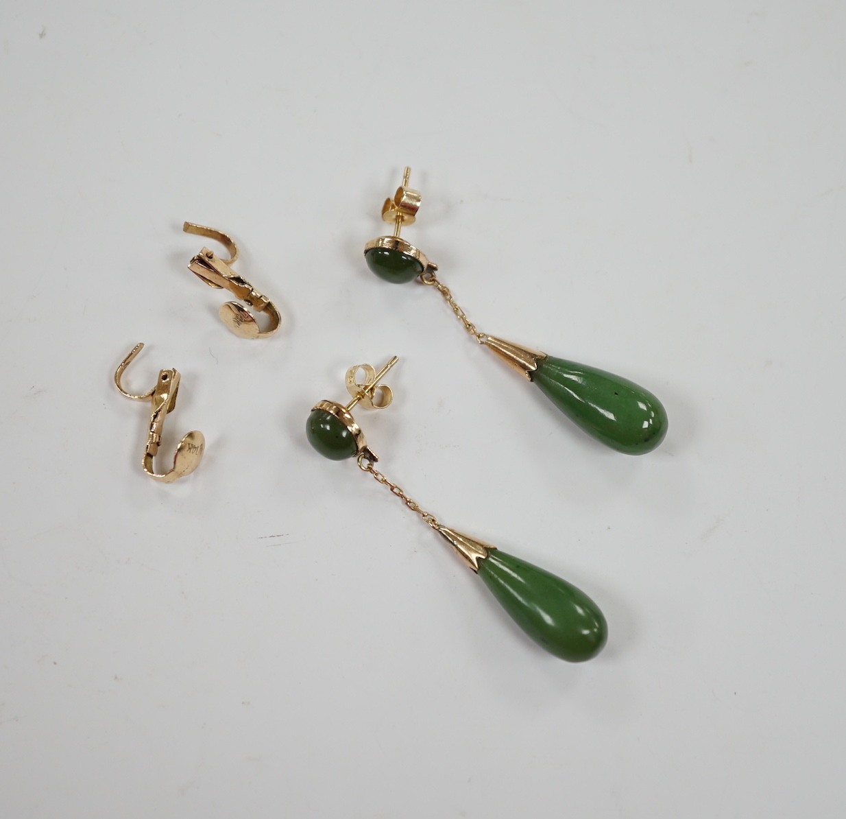 A pair of 375 and two stone jade set drop earrings, 44mm, with a pair of 14k fittings.                                                                                                                                      