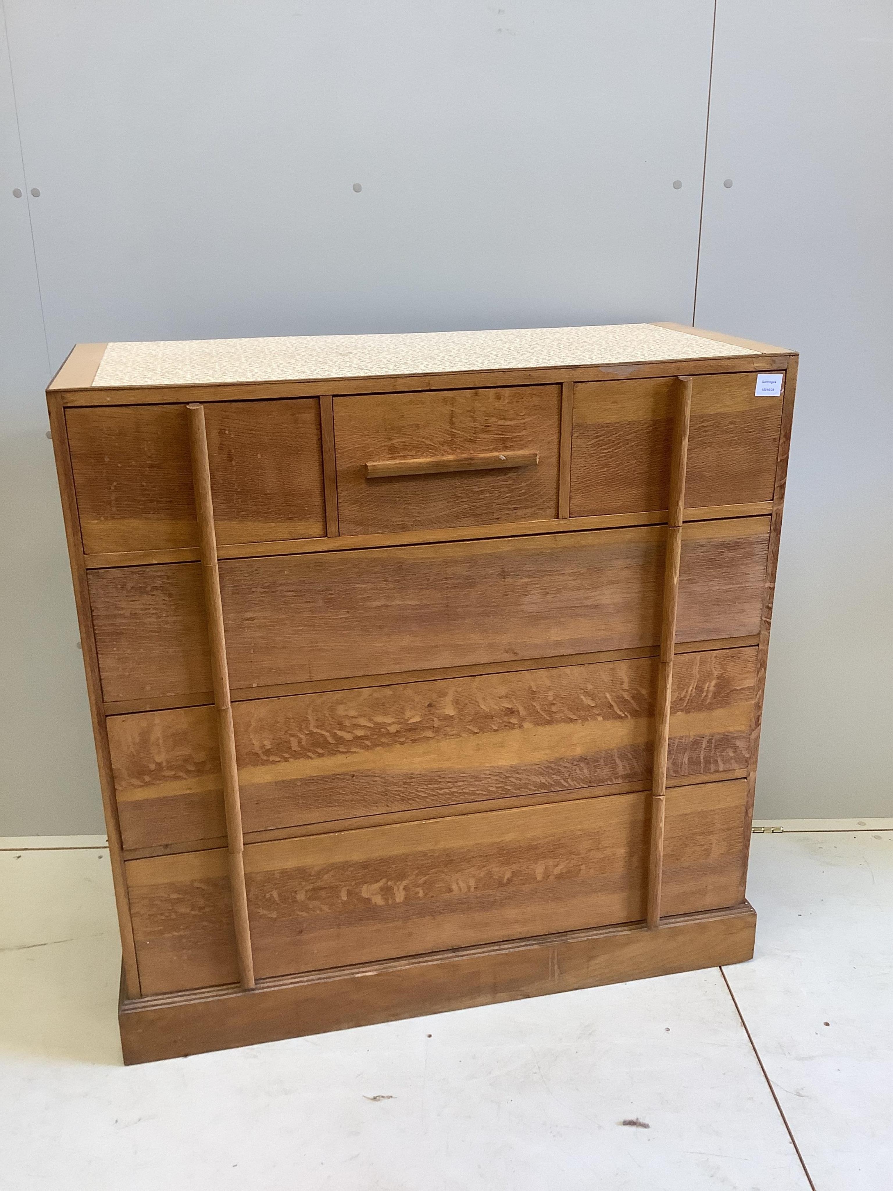 A mid century Heals style oak chest of six drawers with later top, width 106cm, depth 46cm, height 109cm. Condition - poor to fair                                                                                          