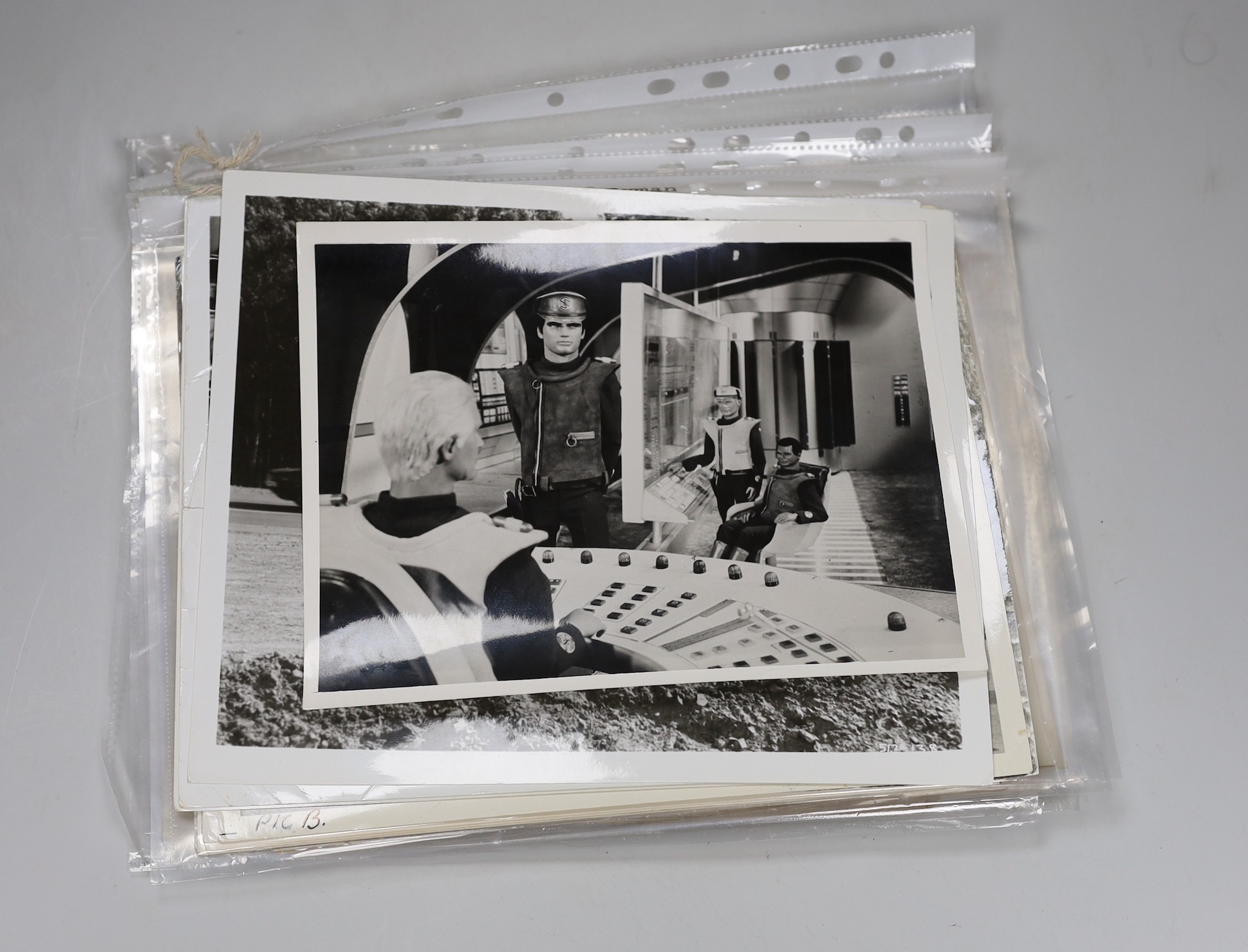 Assorted Warner Bros black and white photographs, various subjects; Thunderbirds, Steve McQueen Bullitt & Herbie as well as early 20th century group portraits, largest 20 x 26cm.                                          