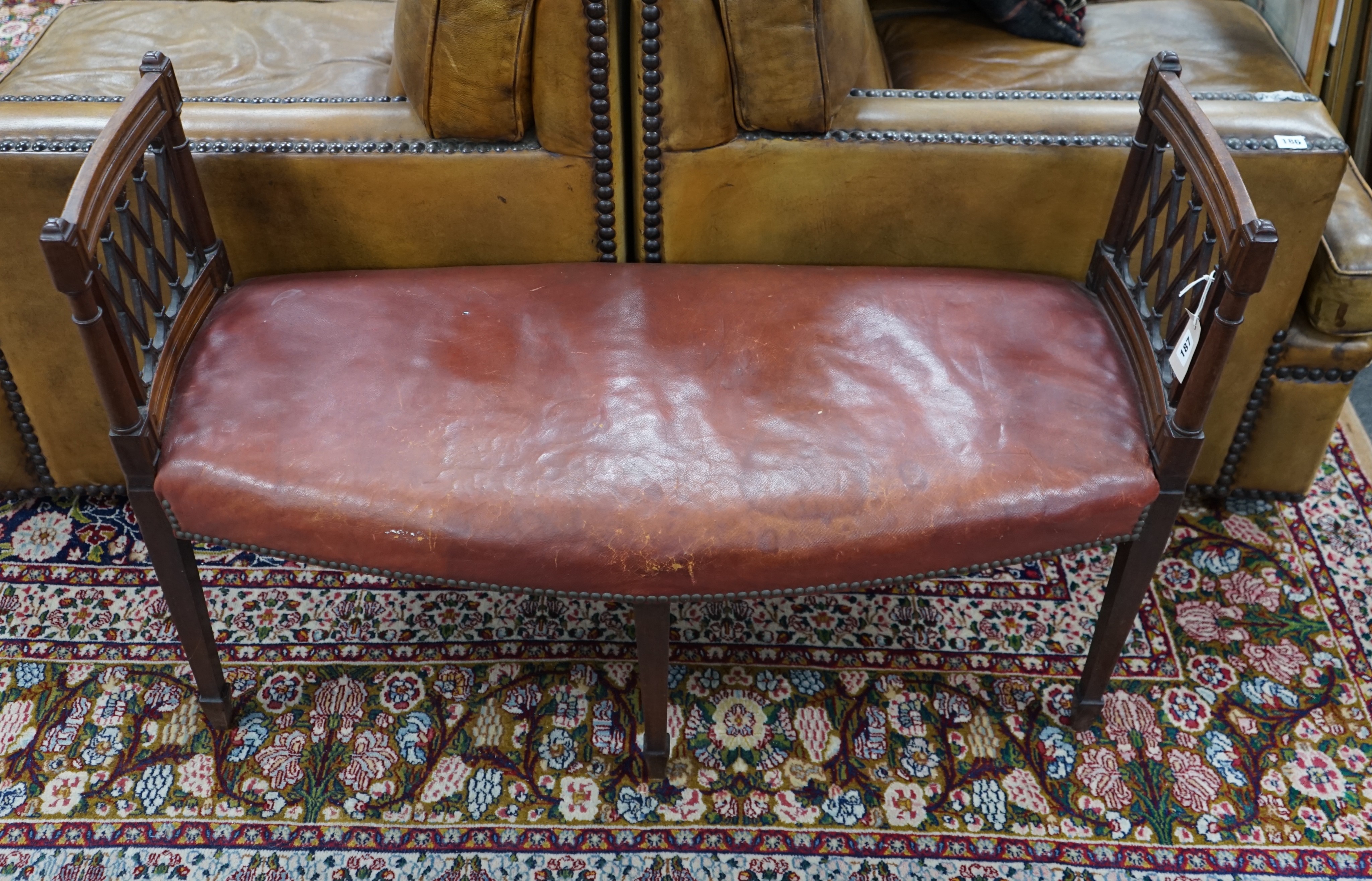 An Edwardian Sheraton Revival mahogany window seat, length 109cm, depth 43cm, height 73cm                                                                                                                                   