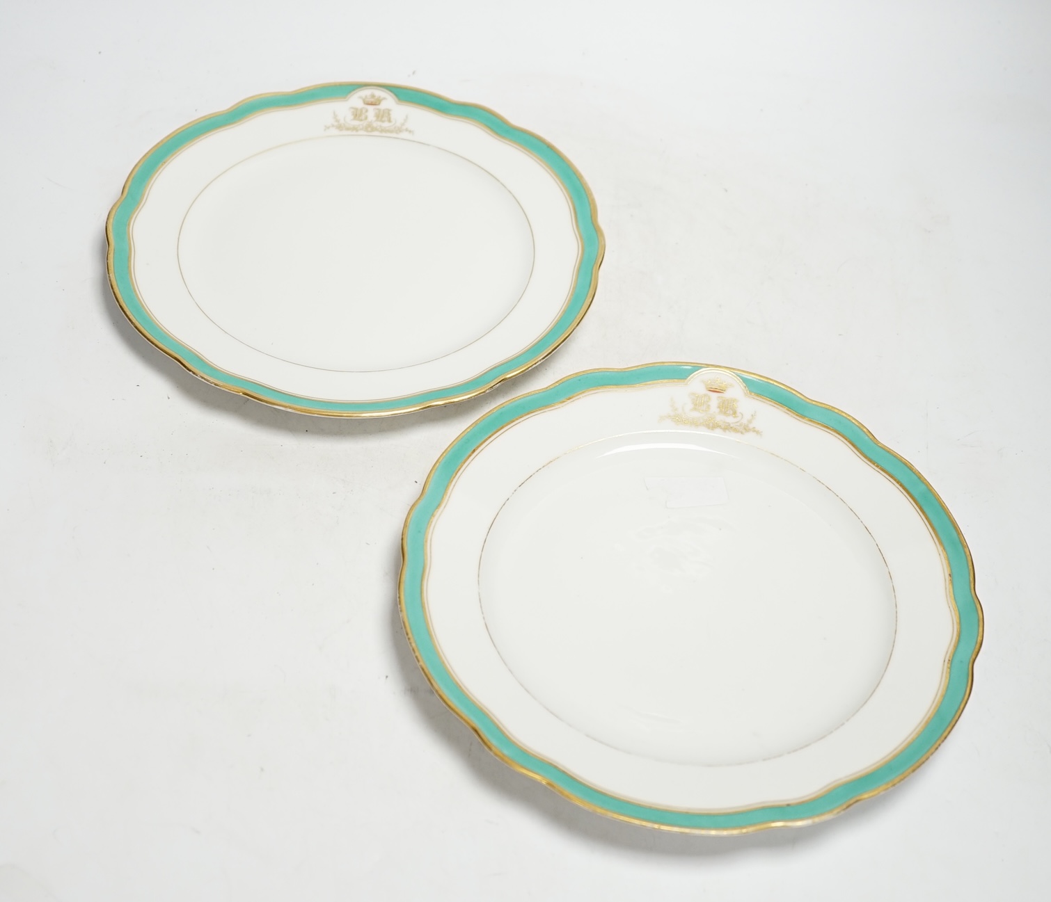 A pair of Russian Imperial Porcelain Factory plates with Alexander cipher to the reverse and crowned gilt monogram ‘BK’ to edge, 25cm diameter                                                                              