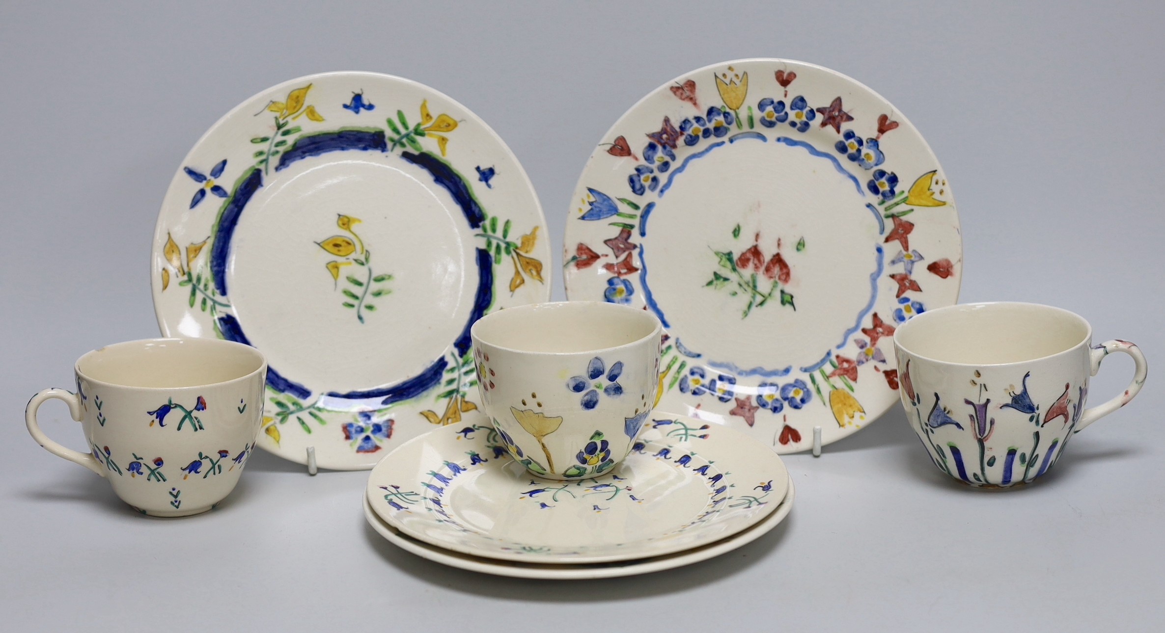 Jessie Marion King (1875-1949), four various floral design tea plates and three tea cups                                                                                                                                    