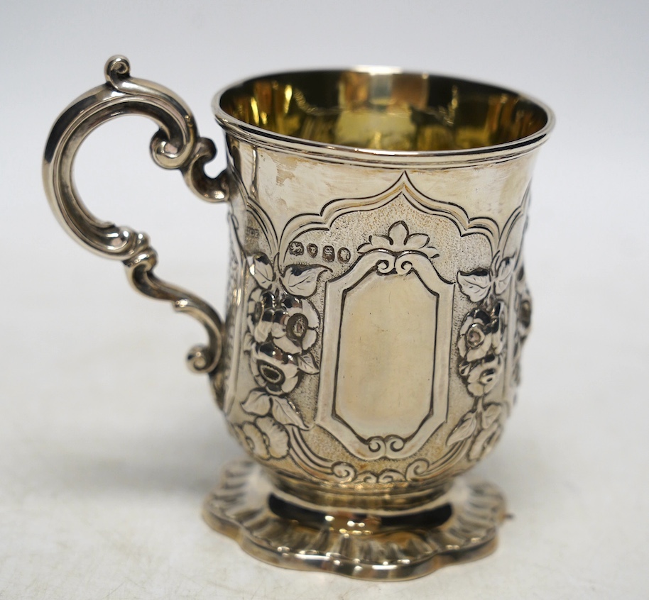 A Victorian silver christening mug, embossed with a gentleman with birds and dogs, James Charles Edington, London, 1853, 10.5cm, 6.6oz. Condition - fair to good                                                            