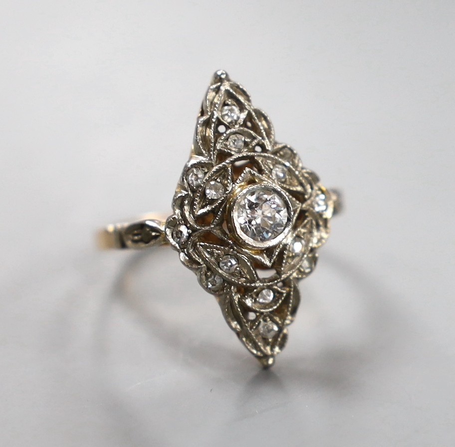 A 1950's Soviet 583 yellow metal (14k) and diamond set marquise cluster ring, size P/Q, gross weight 4.1 grams.                                                                                                             