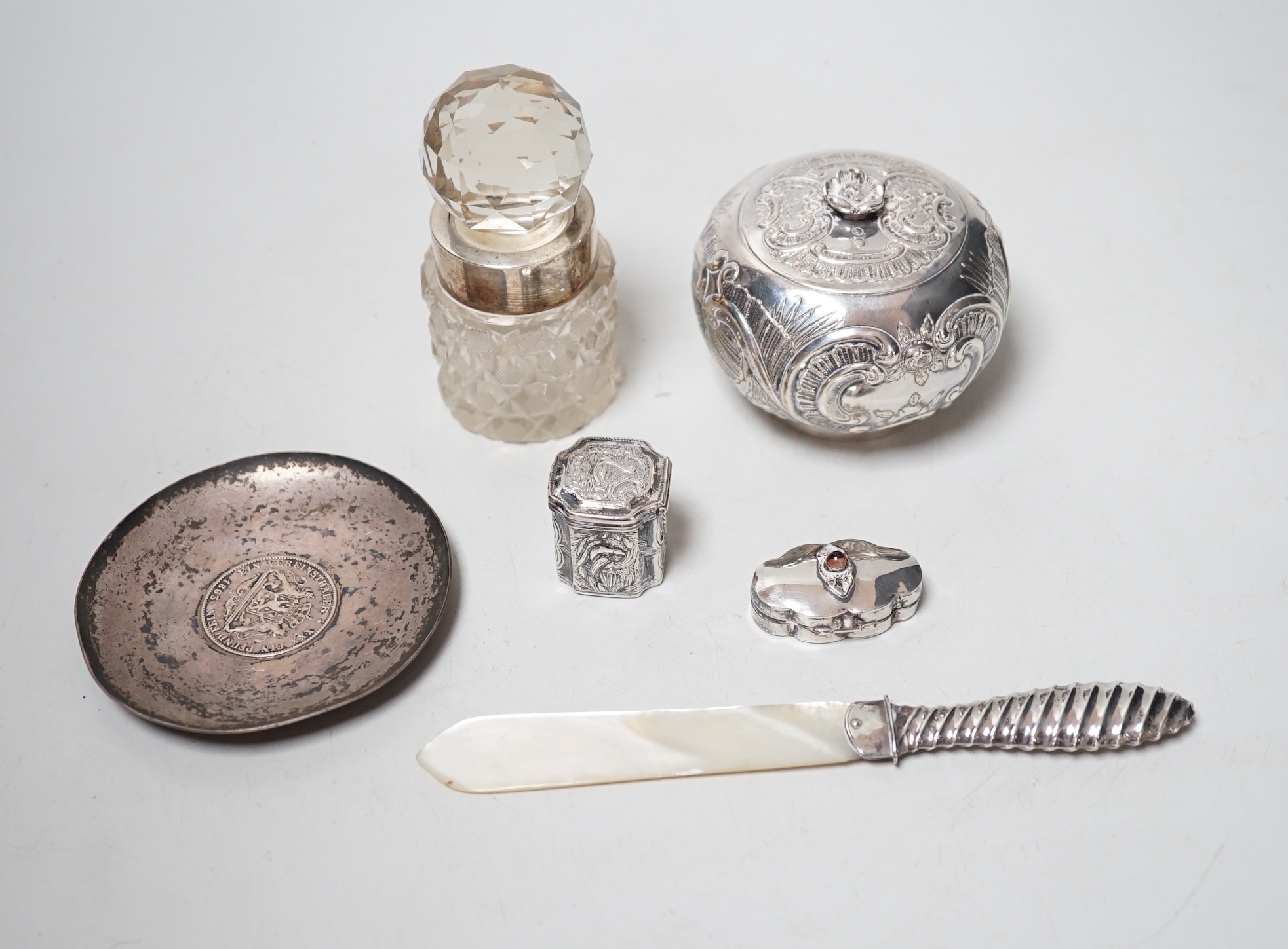 A German white metal jar and cover, dish, mounted jar, paper knife and two trinket boxes                                                                                                                                    