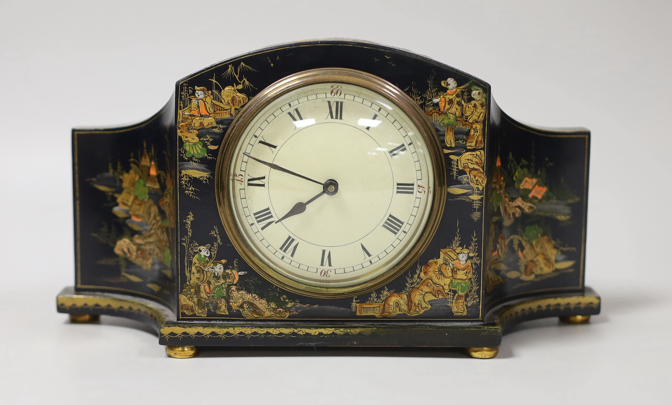 A French japanned mantel timepiece, 26cm wide                                                                                                                                                                               