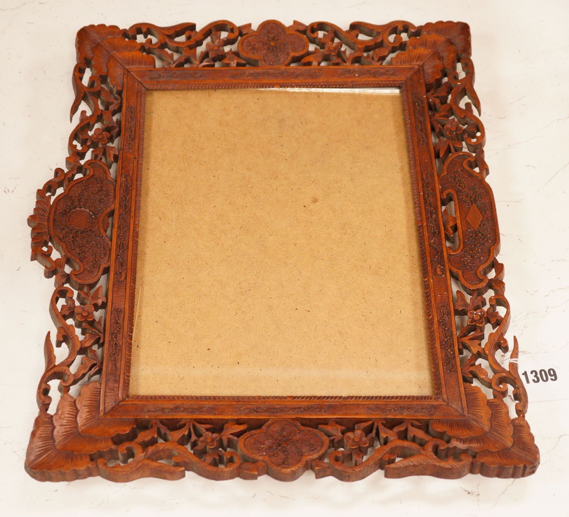 A Chinese carved sandalwood picture frame, 36x41 cm total                                                                                                                                                                   