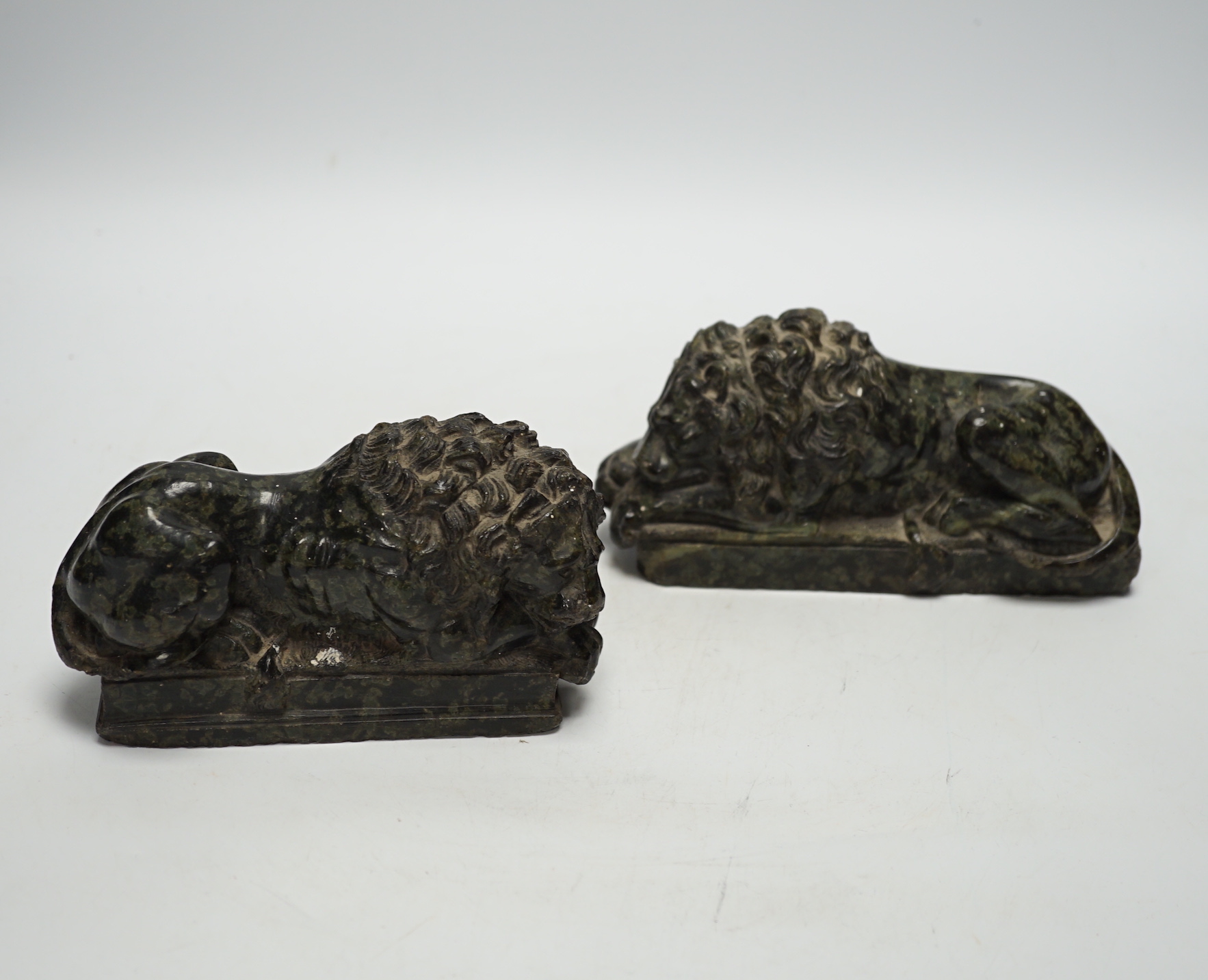 A pair of carved serpentine models of the Lucerne lions, 16cm wide                                                                                                                                                          