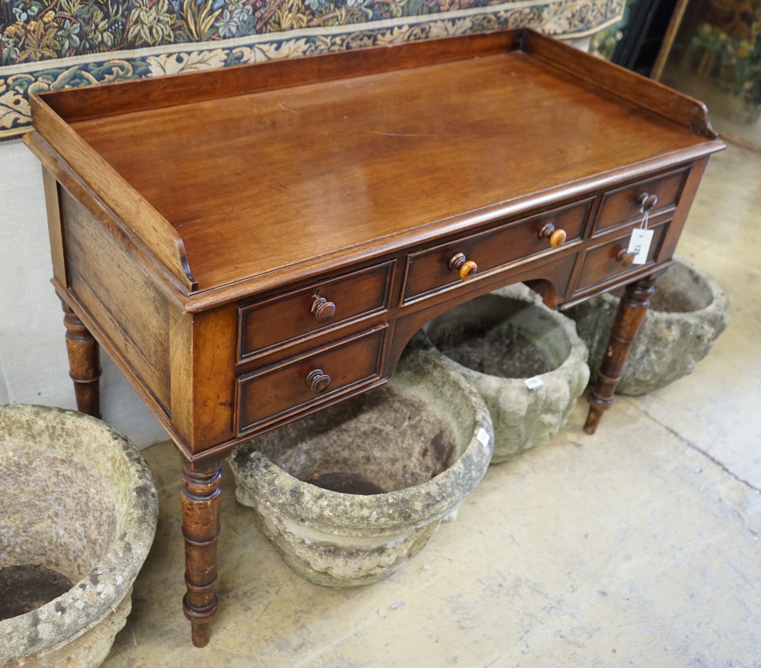 A Victorian mahogany kneehole dressing table, width 112cm, depth 52cm, height 79cm                                                                                                                                          