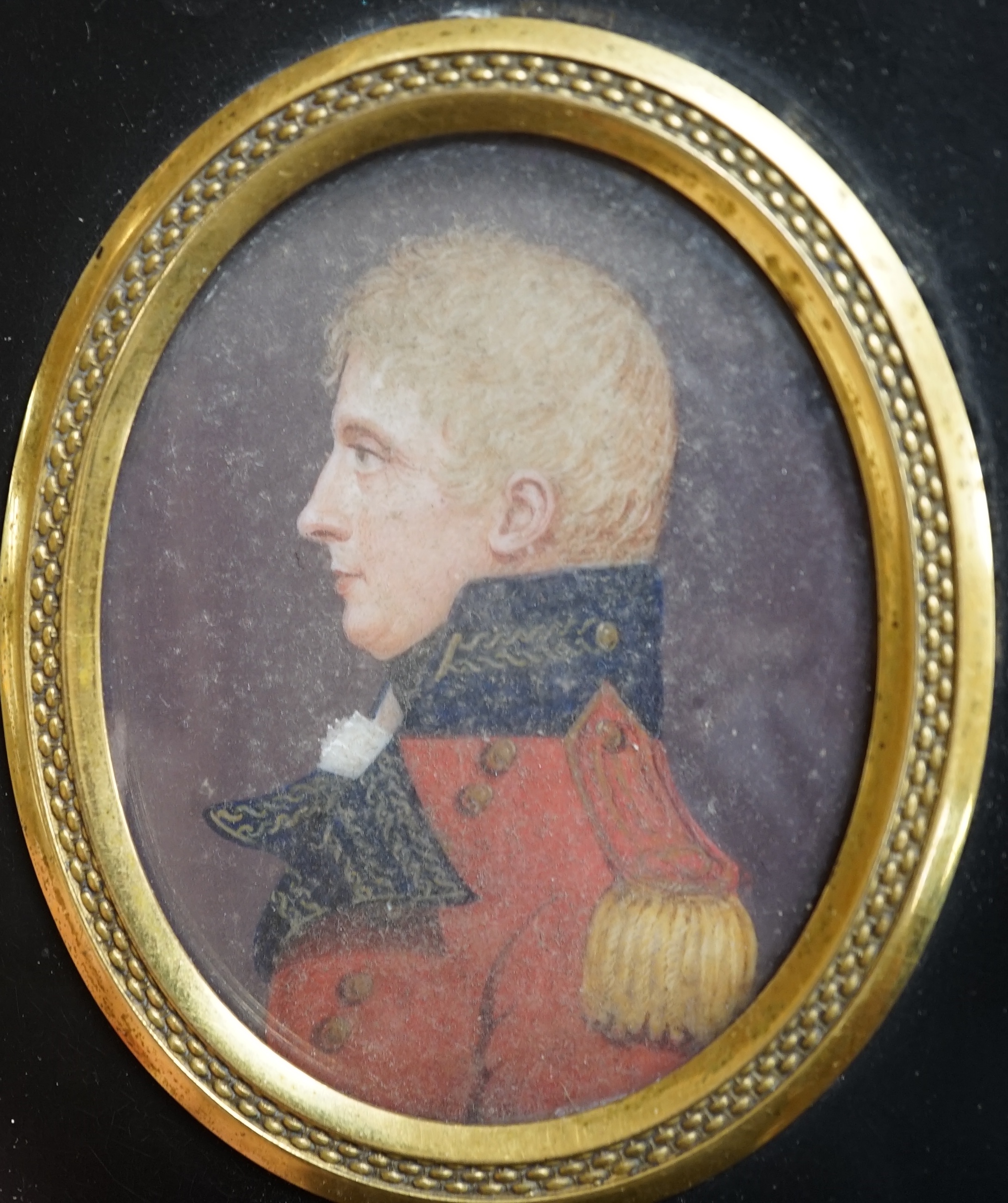 J.T. Mitchell (19th. C), set of four family portrait miniatures on ivory, including a gentleman wearing military uniform, various ink inscriptions verso, 7 x 5cm. CITES Submission reference SG9FKQRE. Condition - fair    